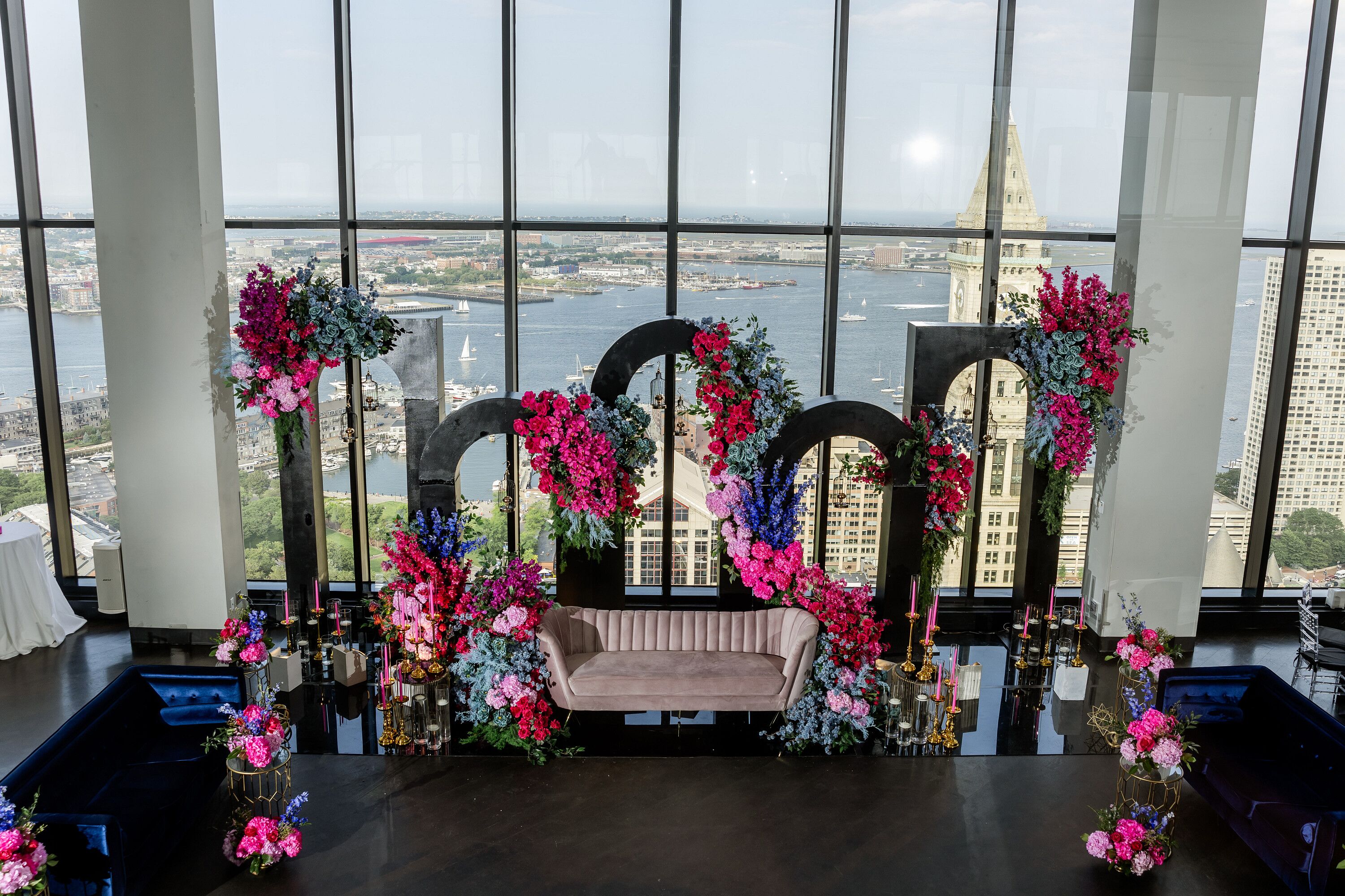 Glamorous Sangeet Backdrop of Varying Arches, Bold-Colored Flowers With ...