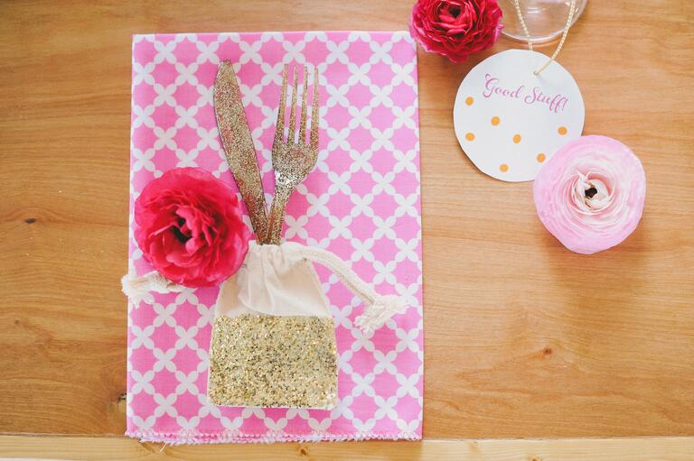Small gold glitter favor bag with silverware 