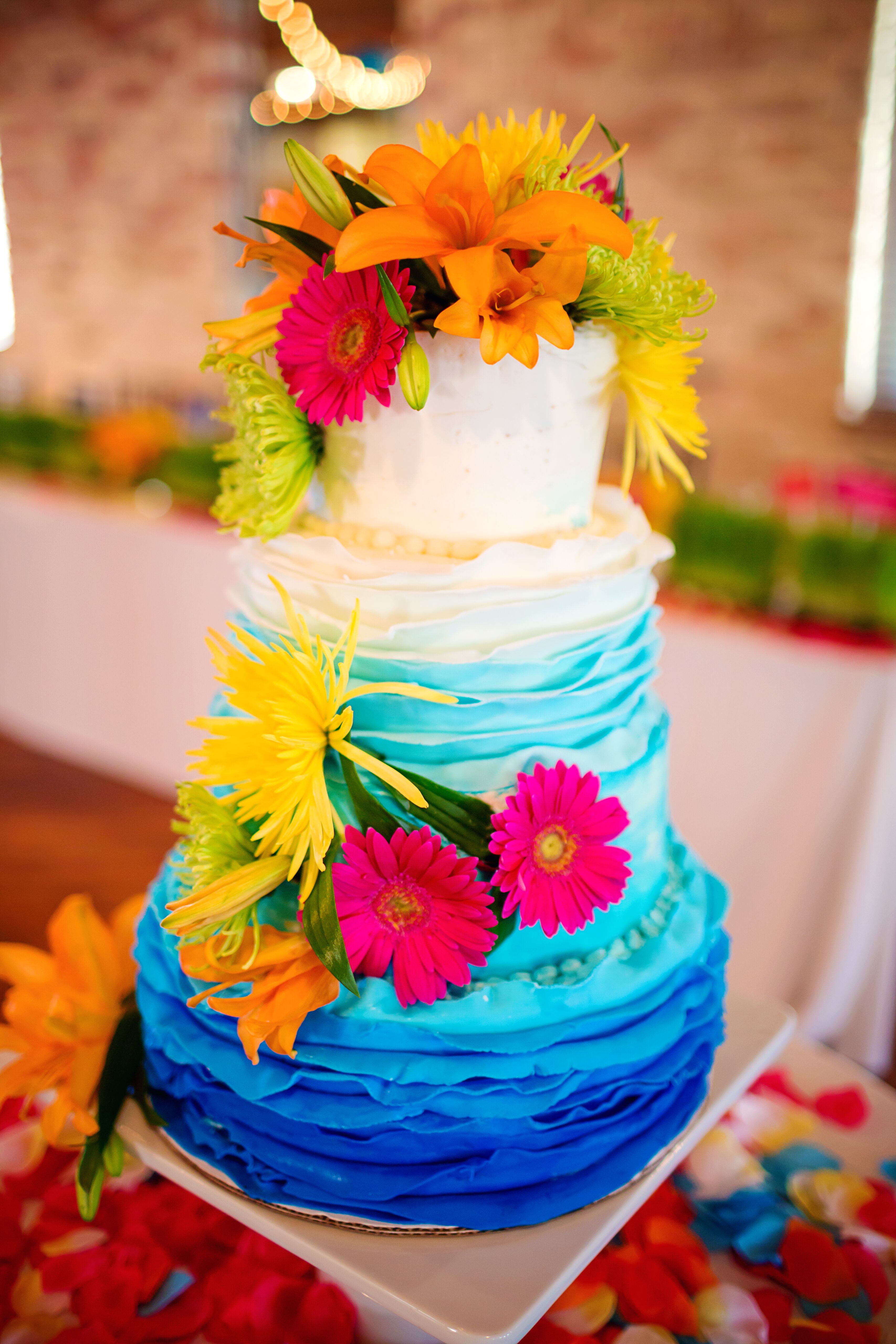 Bright Blue Ombre Wedding Cake With Daisies