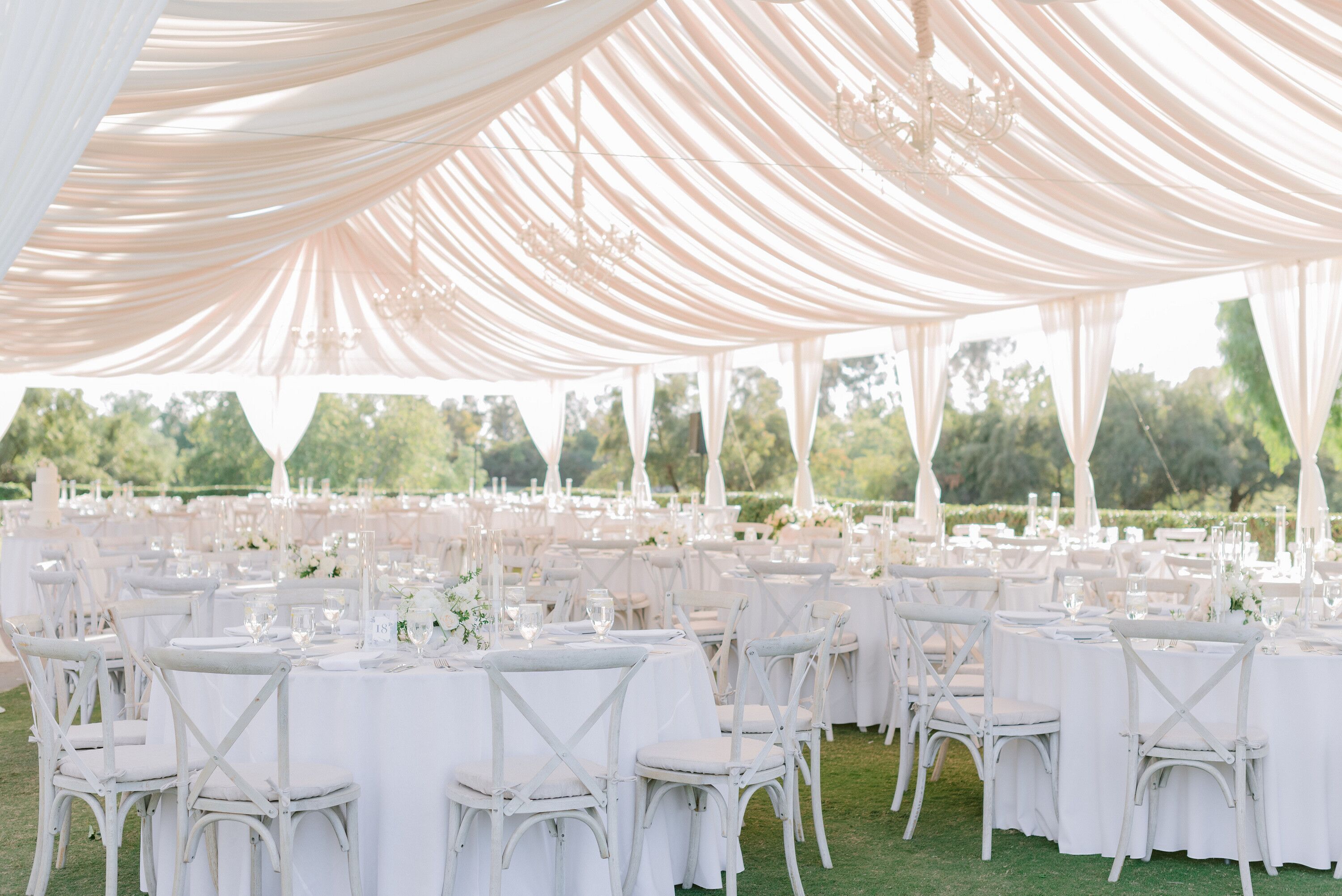 All-White Tent Decor with Fabric Draping