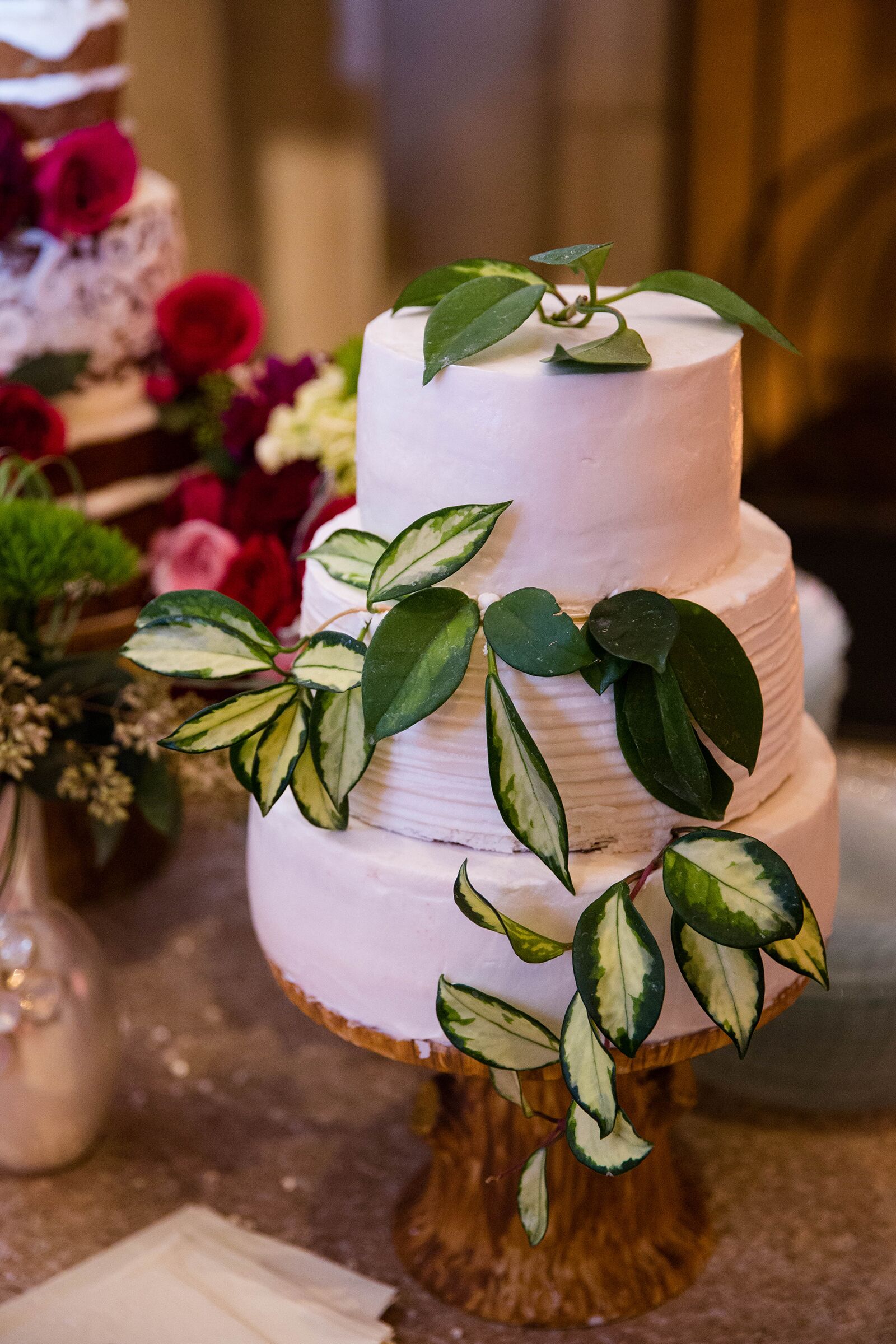 White Wedding Cake With Green Leaves