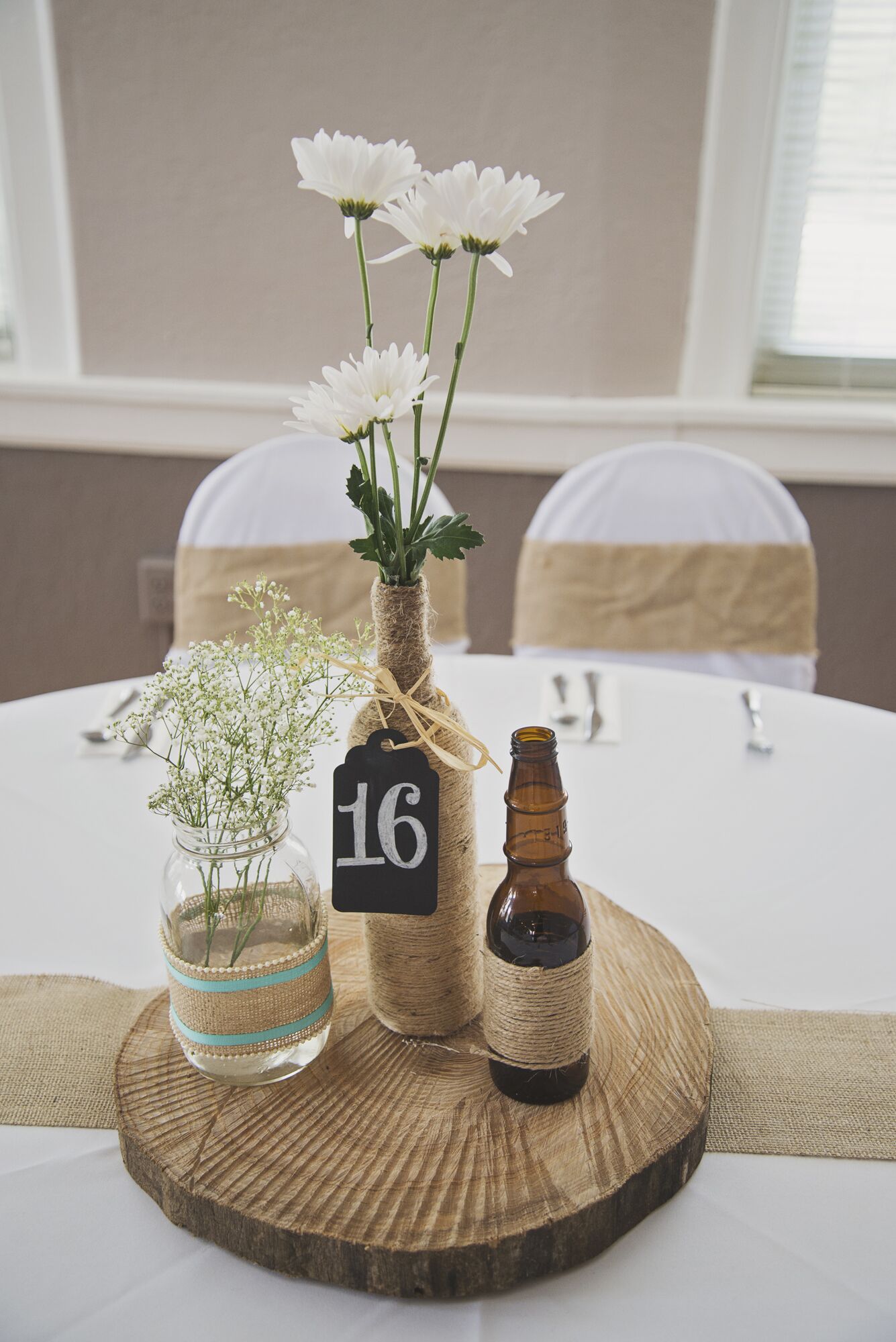 Rustic DIY Tree Stump Centerpieces with Twine Wrapped Beer 