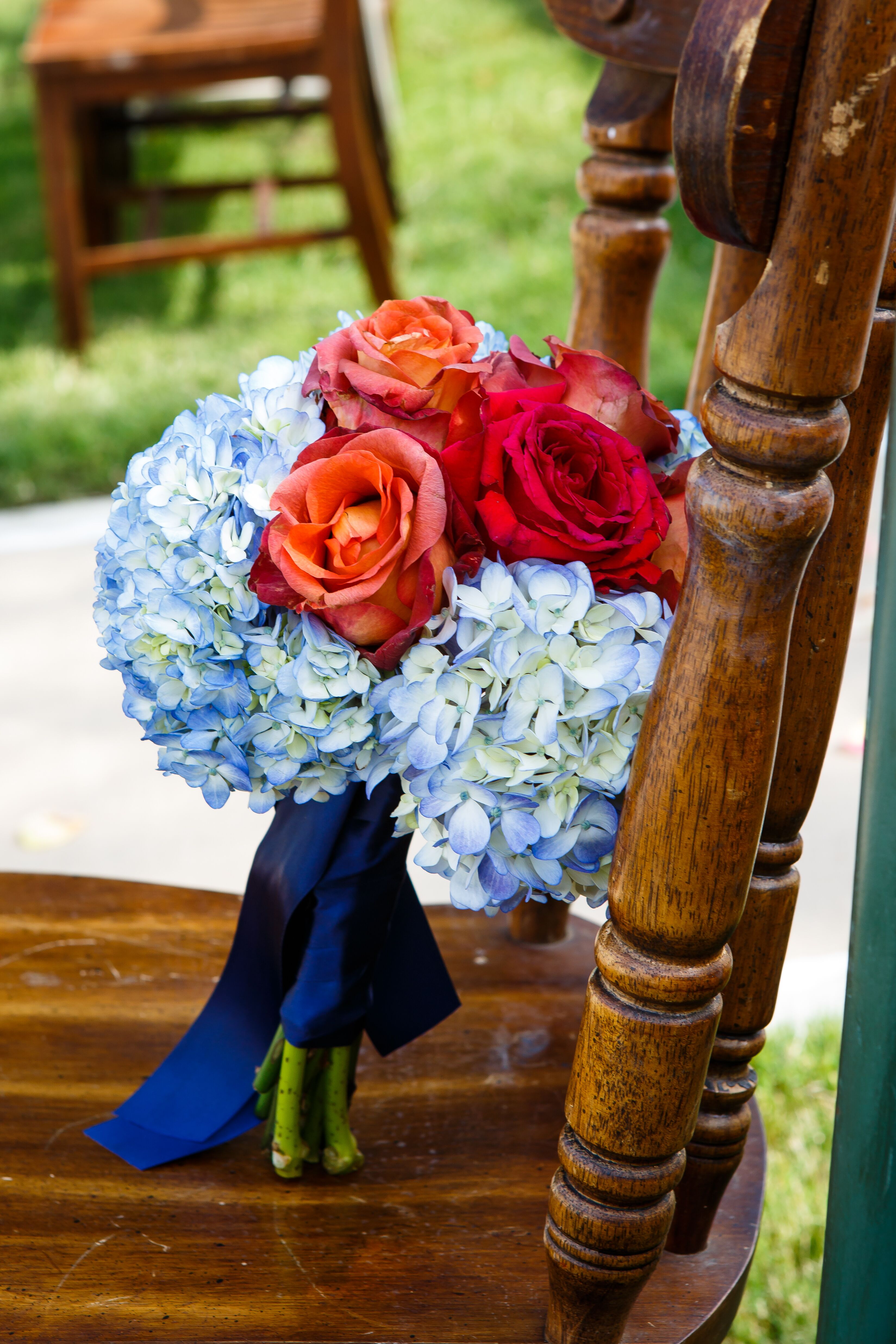 Image of Bouquet of red roses and blue hydrangeas