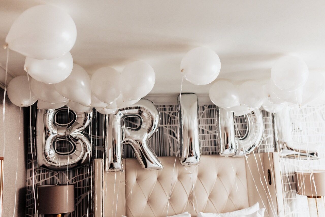 Silver Bride Balloons in a Hotel Room With White Balloons for Getting Ready