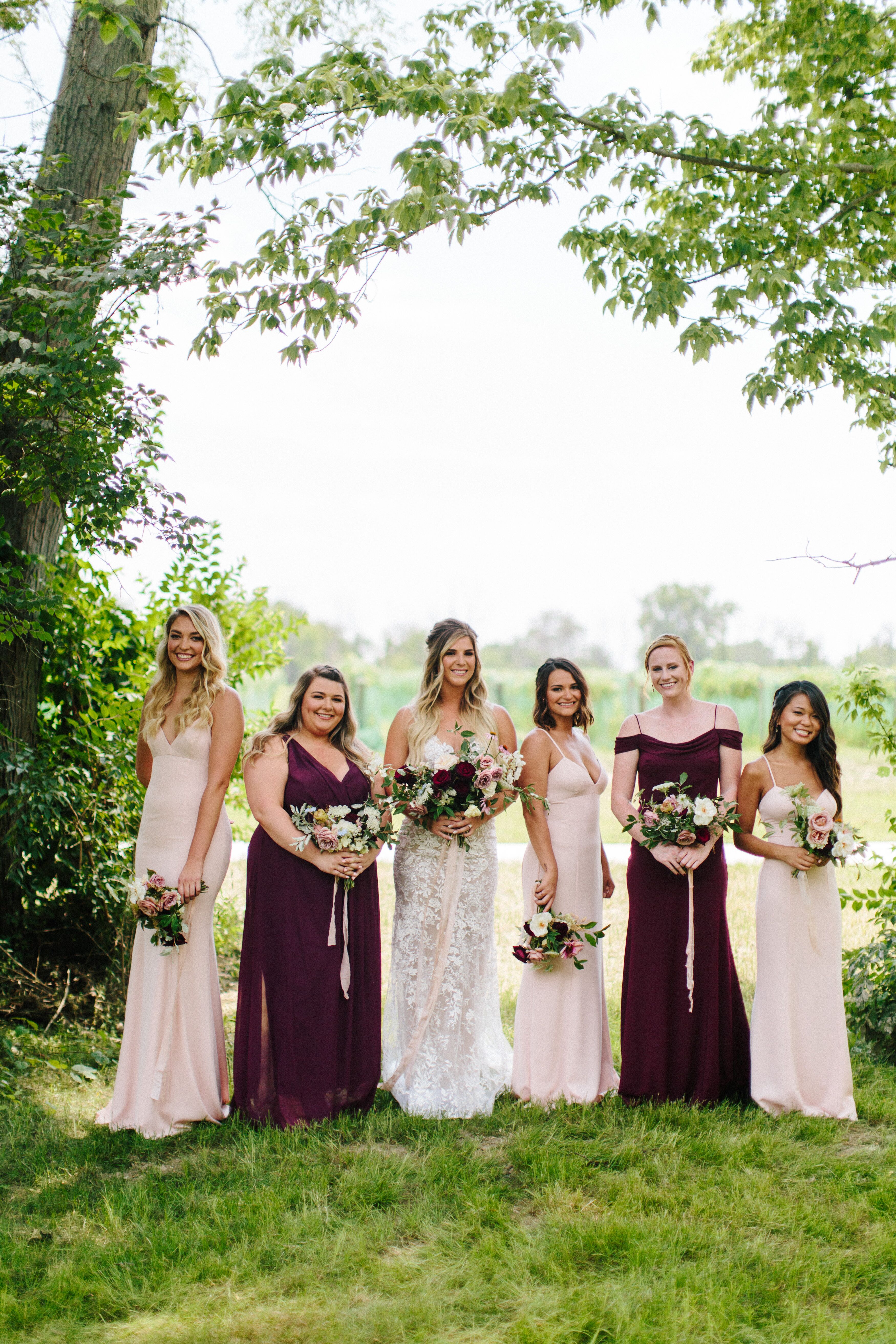 Blush wedding dress with best sale burgundy bridesmaids