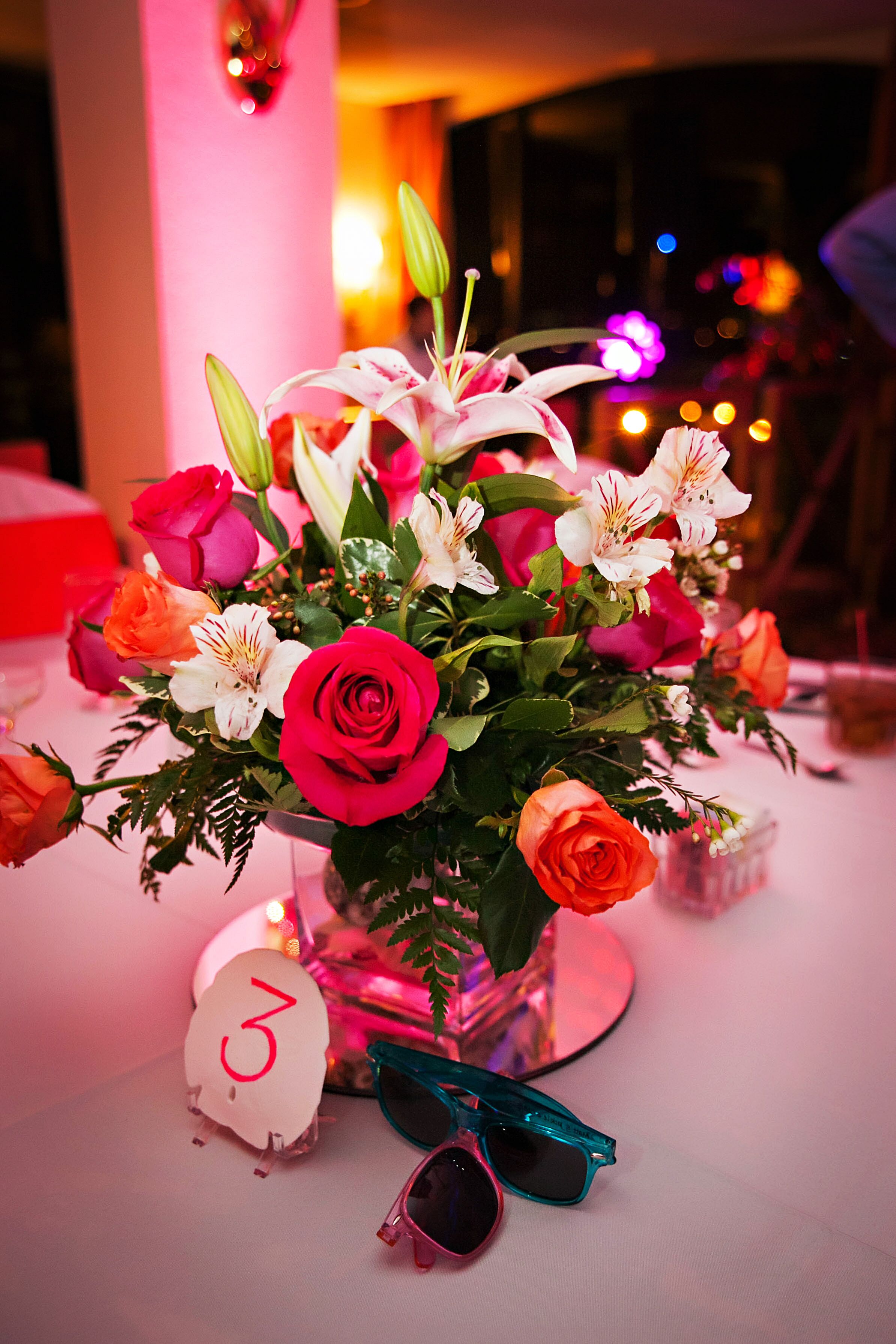 Vibrant Floral And Sand Vase Centerpieces