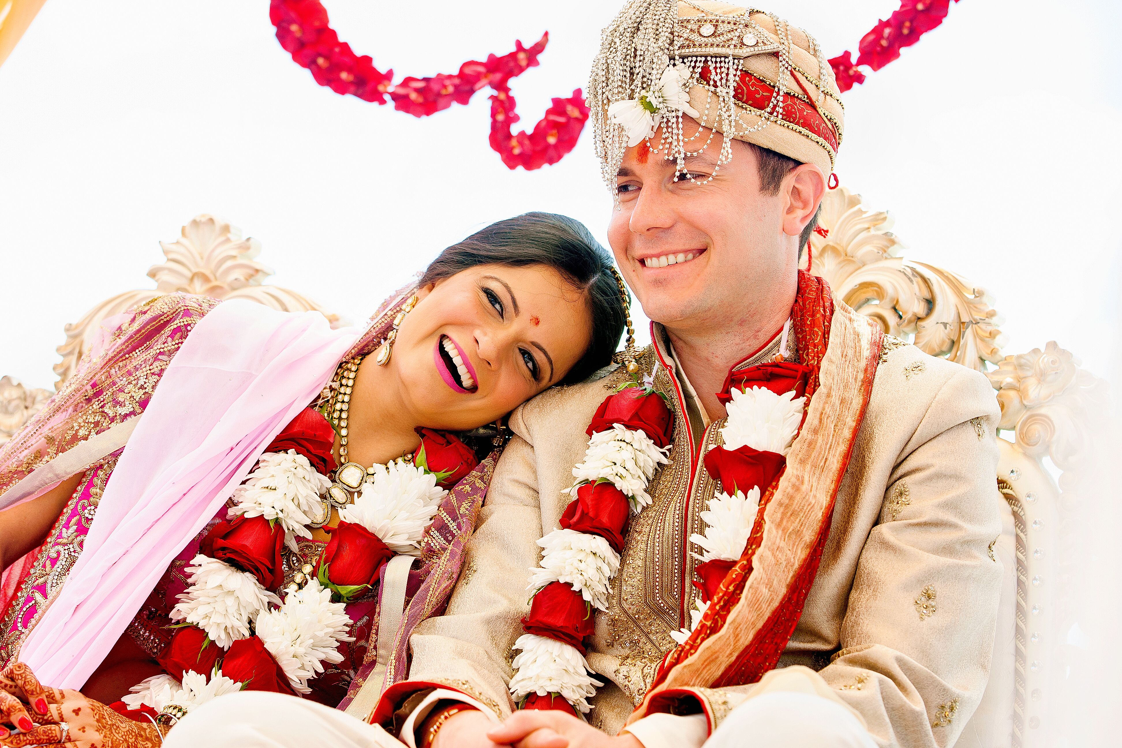 Couple With Red and White Flower Leis