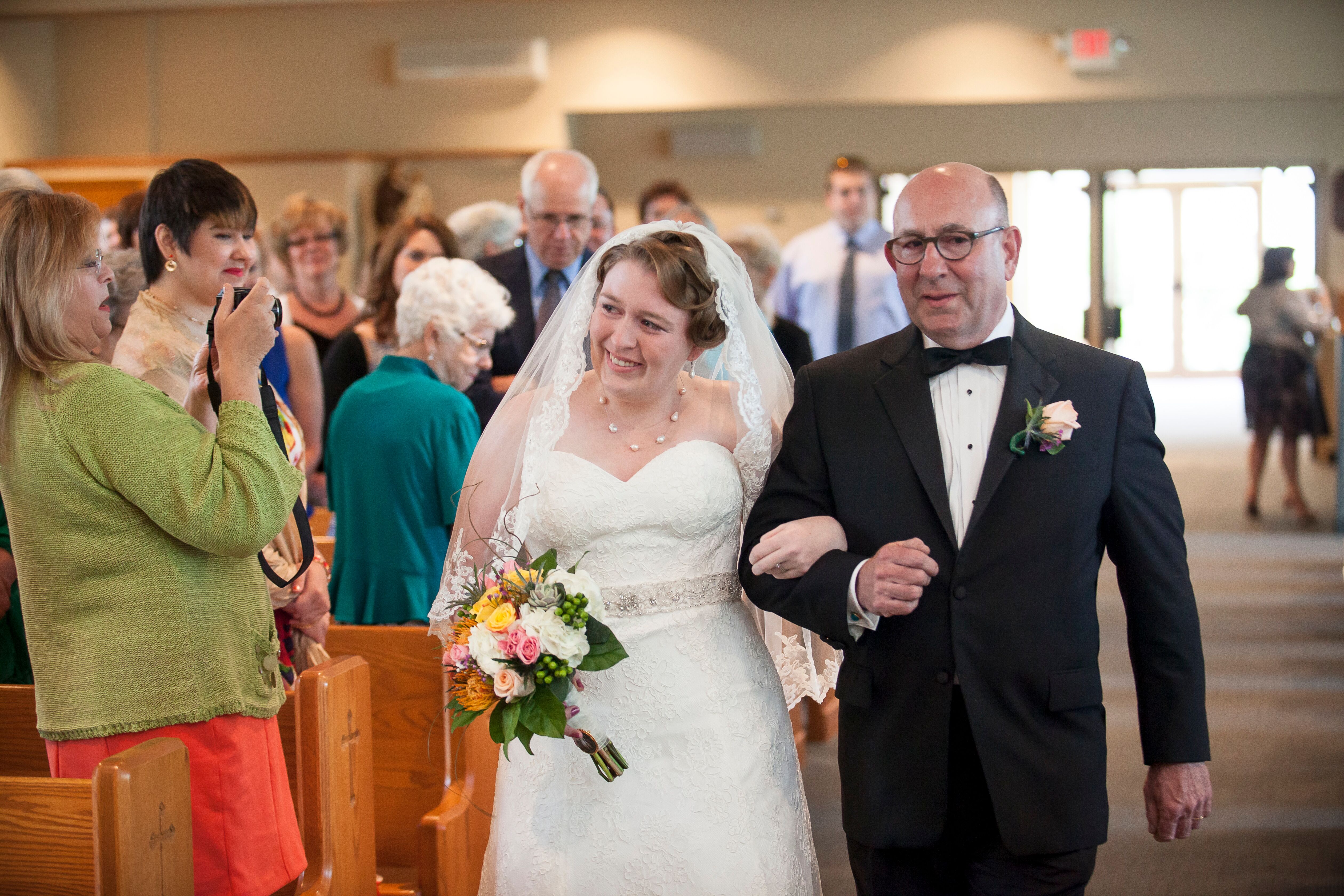 Bride and Father Walking Into Church