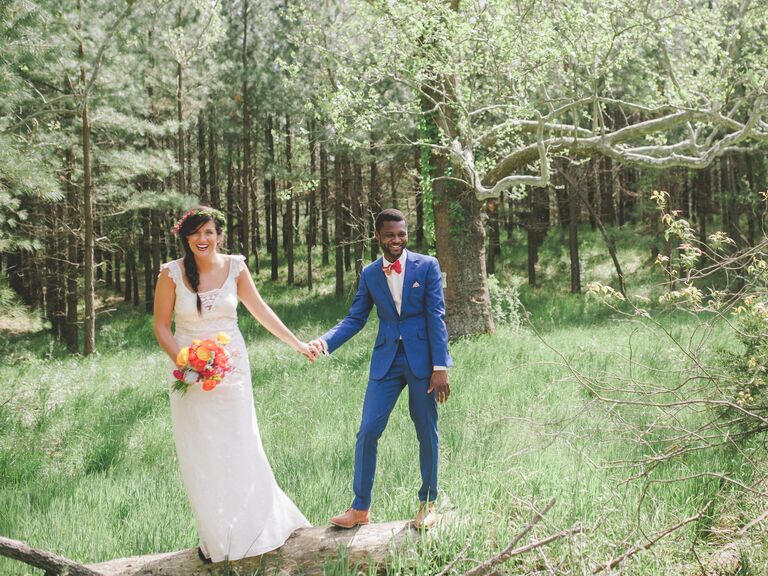 Bride with flower crown and groom in blue suit