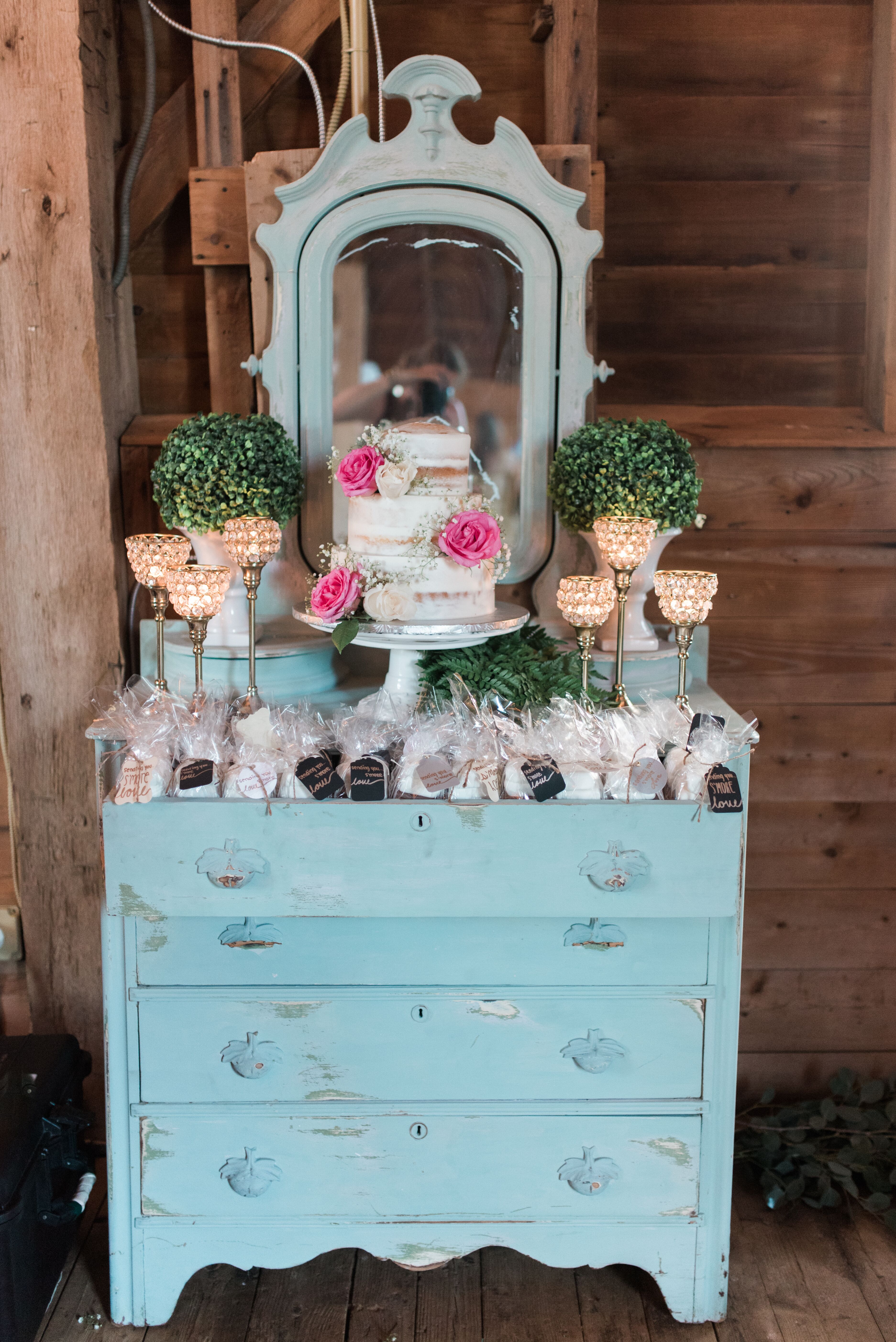 Rustic Cake And Favor Display On Light Blue Vanity