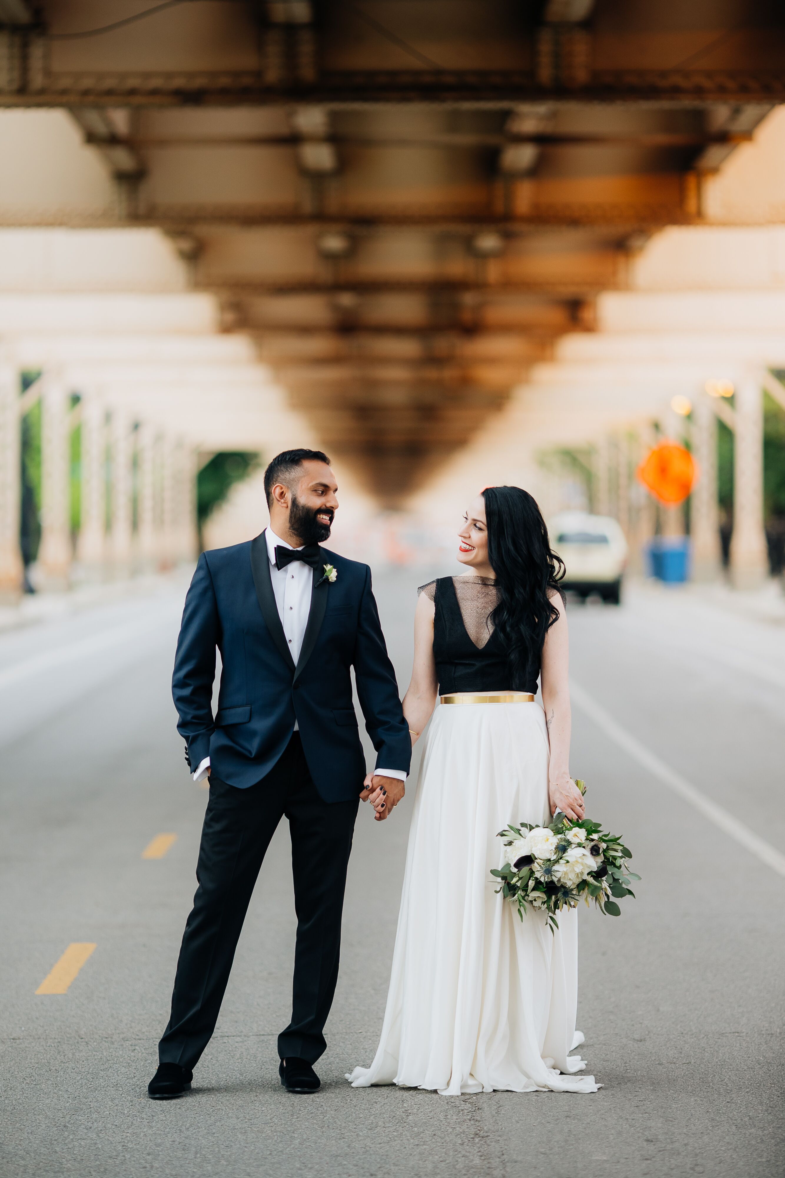 Groom in Navy Tux and Bride Wearing Black and White Dress with