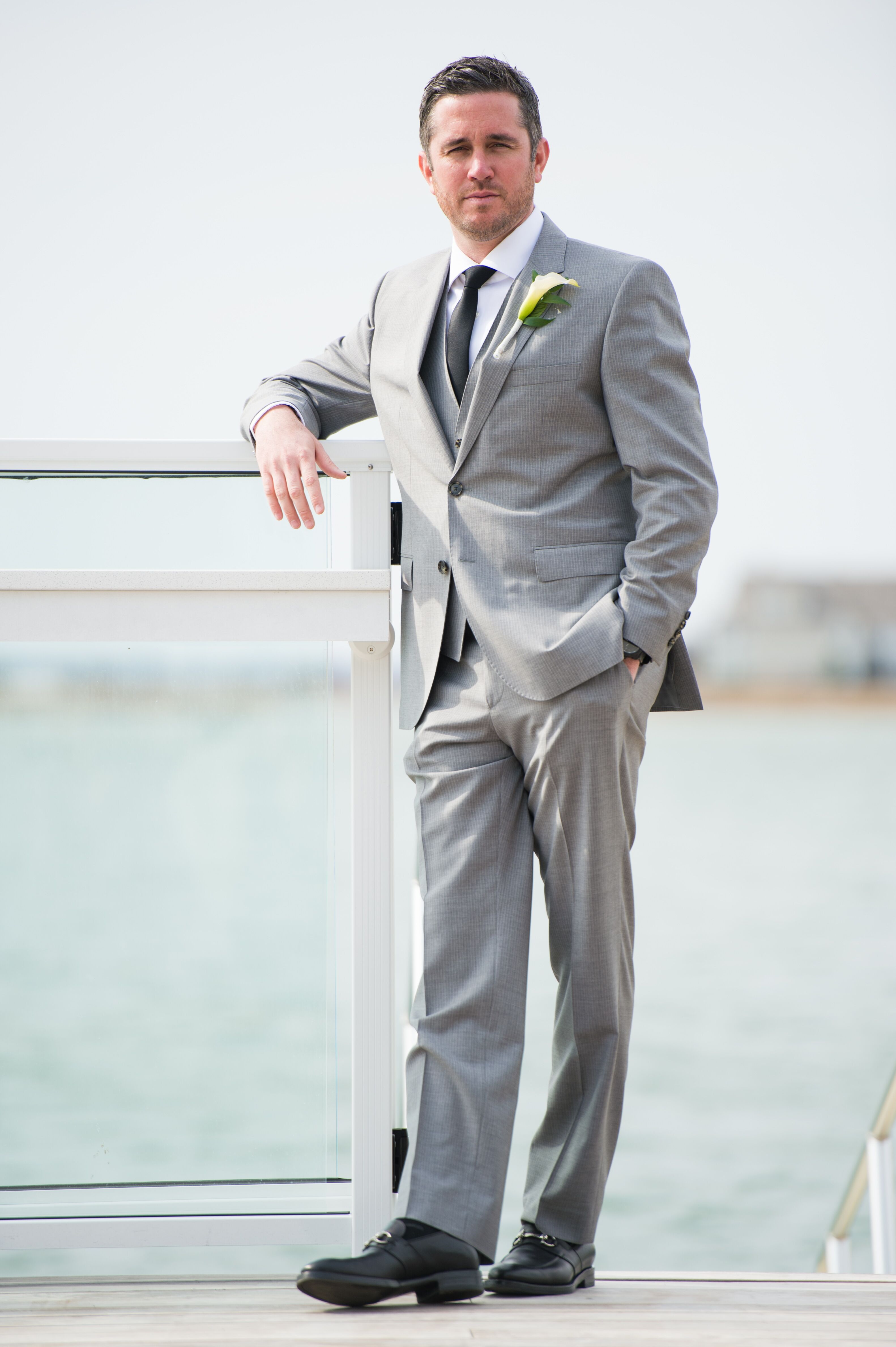 Groom in Pinstripe, Light Gray Suit With Black Tie