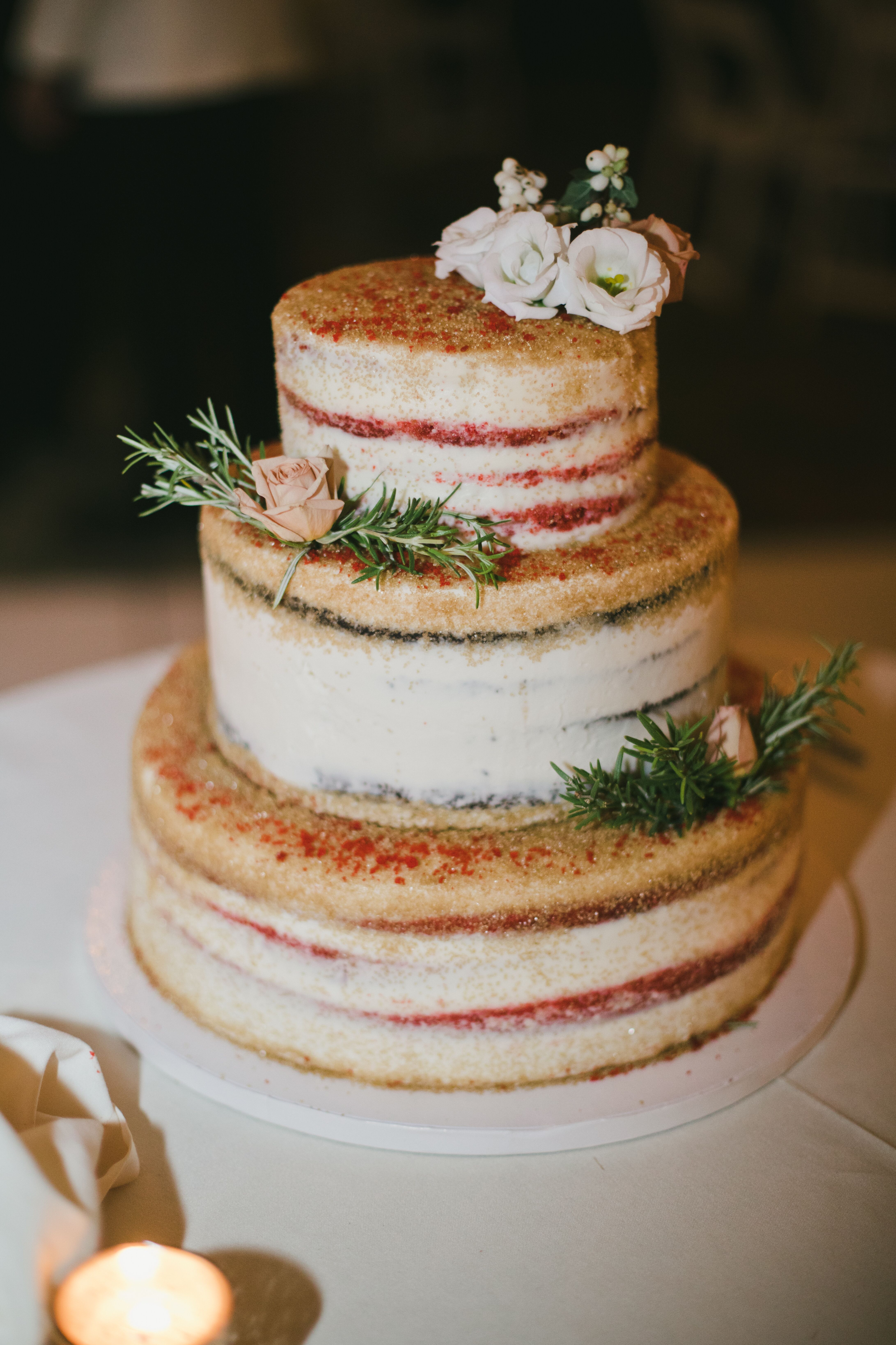 Naked Wedding Cake With Red Filling And Cake Flowers