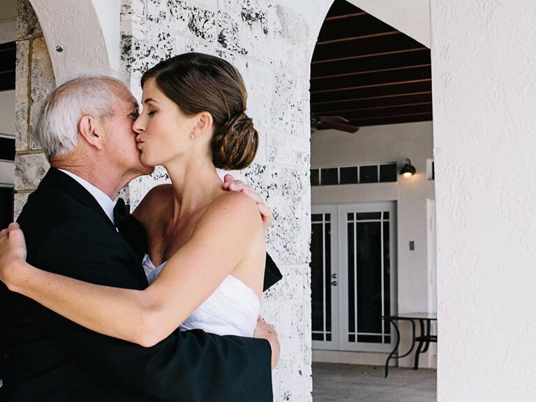 Father of the bride hug before wedding ceremony