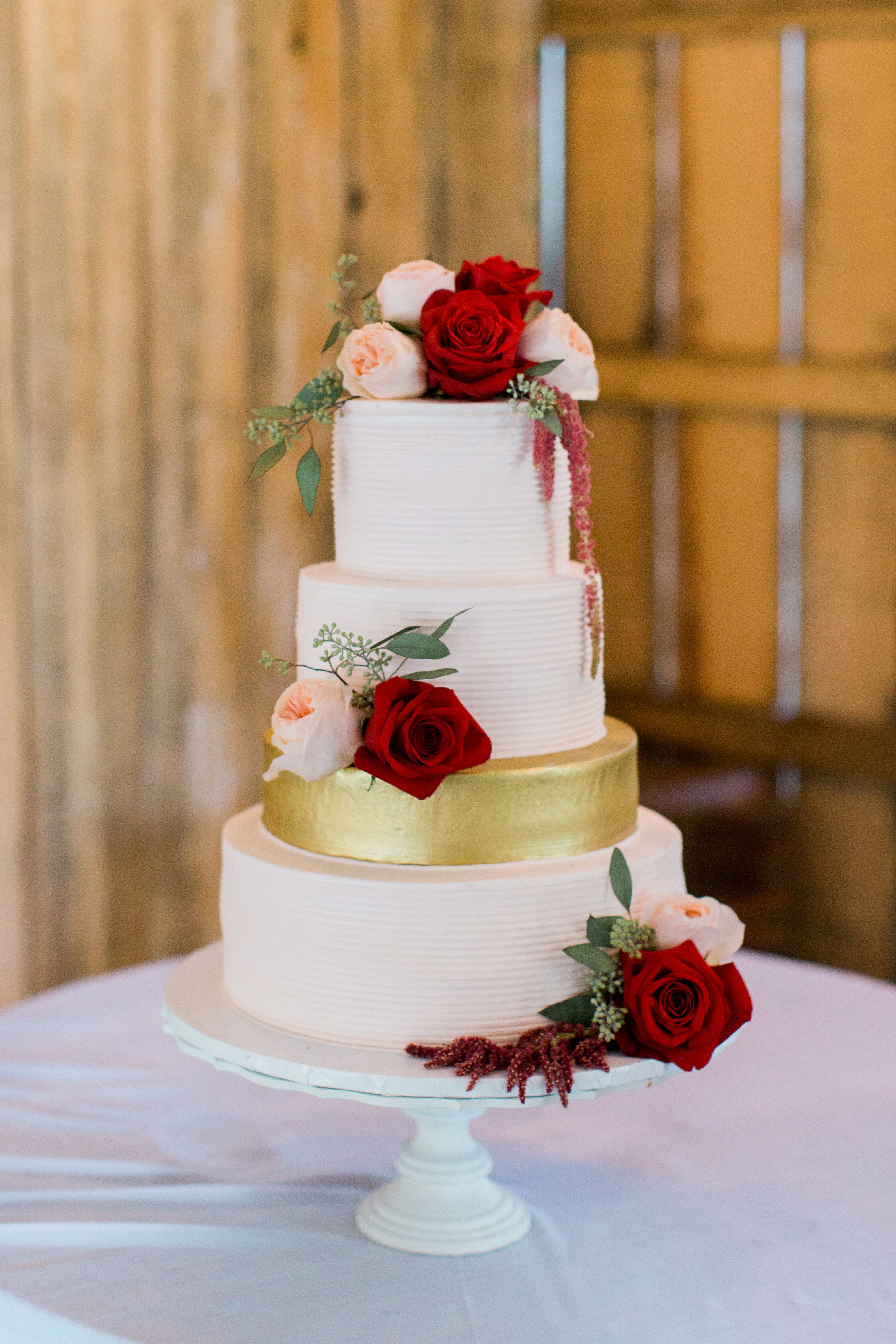 Romantic White Wedding Cake With Burgundy Flowers