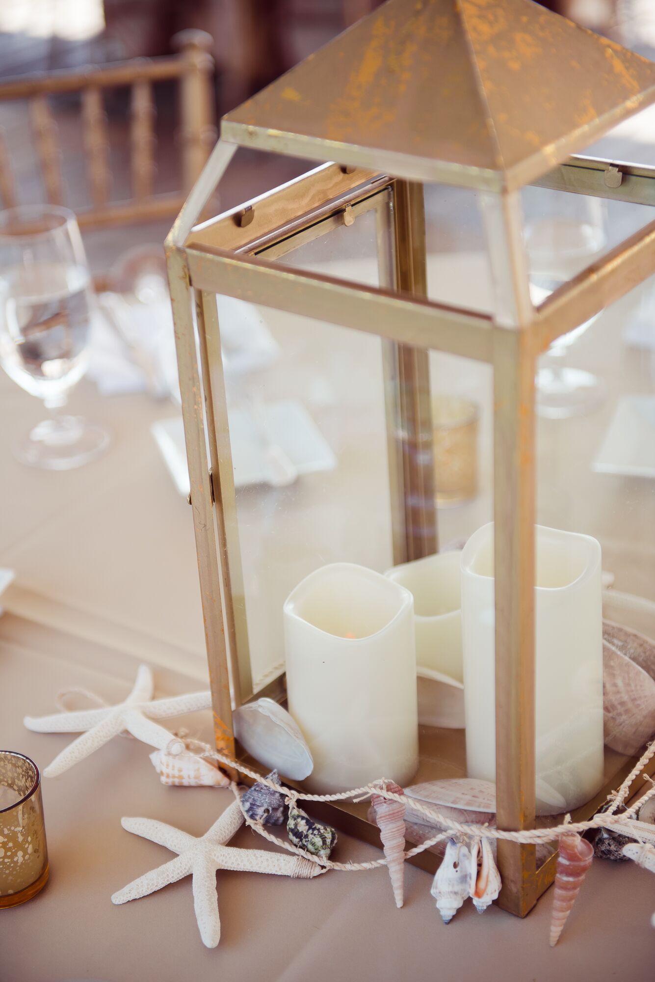 Gold Lantern Centerpiece With Seashell Garland