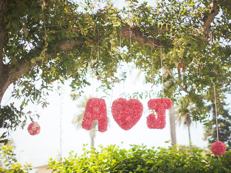Hanging floral monogram at wedding reception