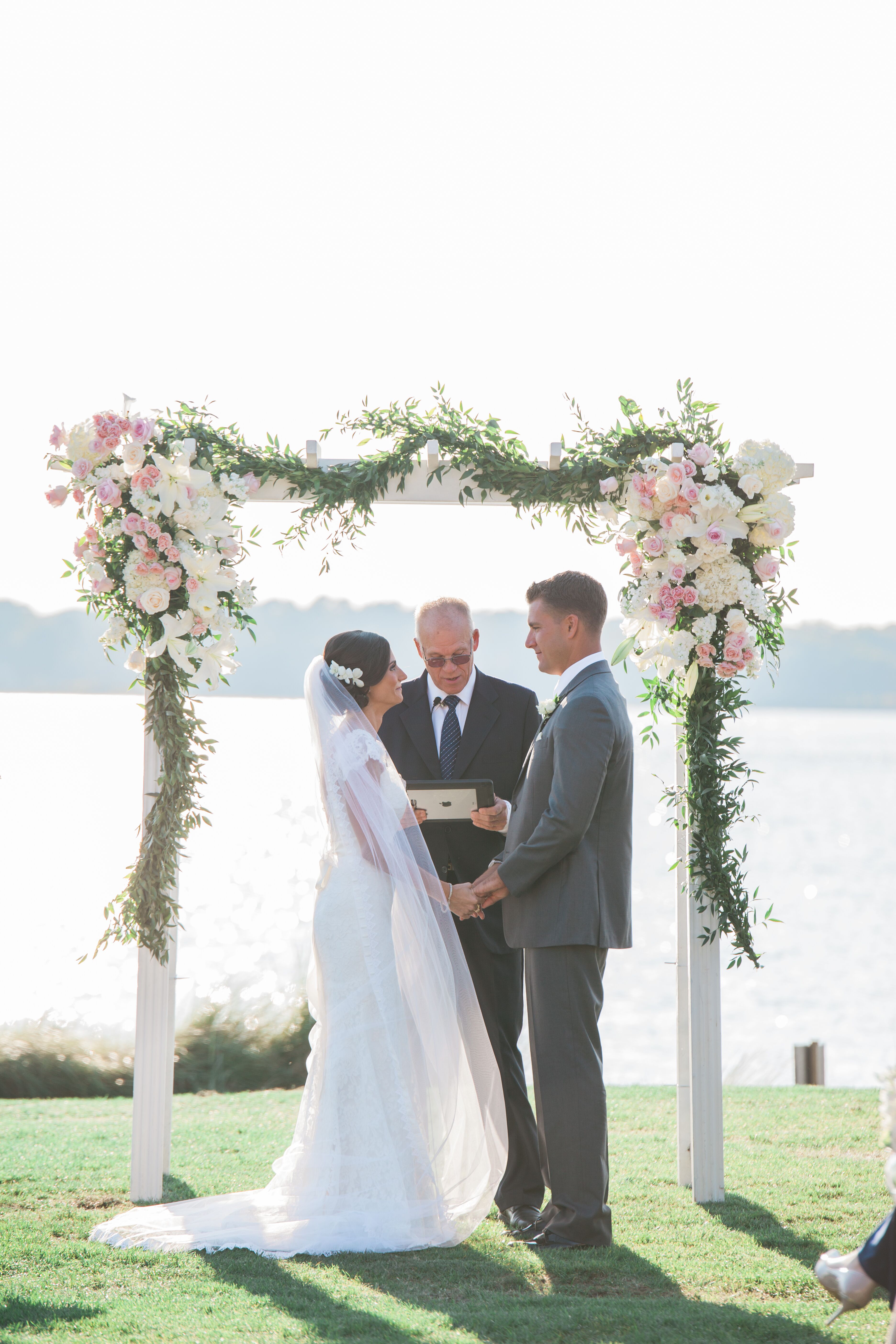 Blush and Ivory Flower-Decorated Wooden Wedding Arch