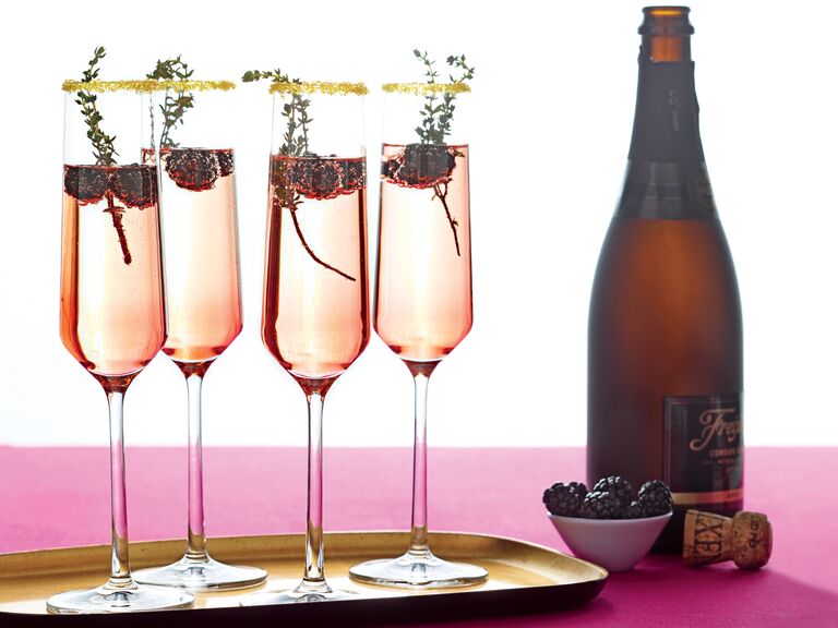 Blackberry champagne wedding cocktail with sugared rim