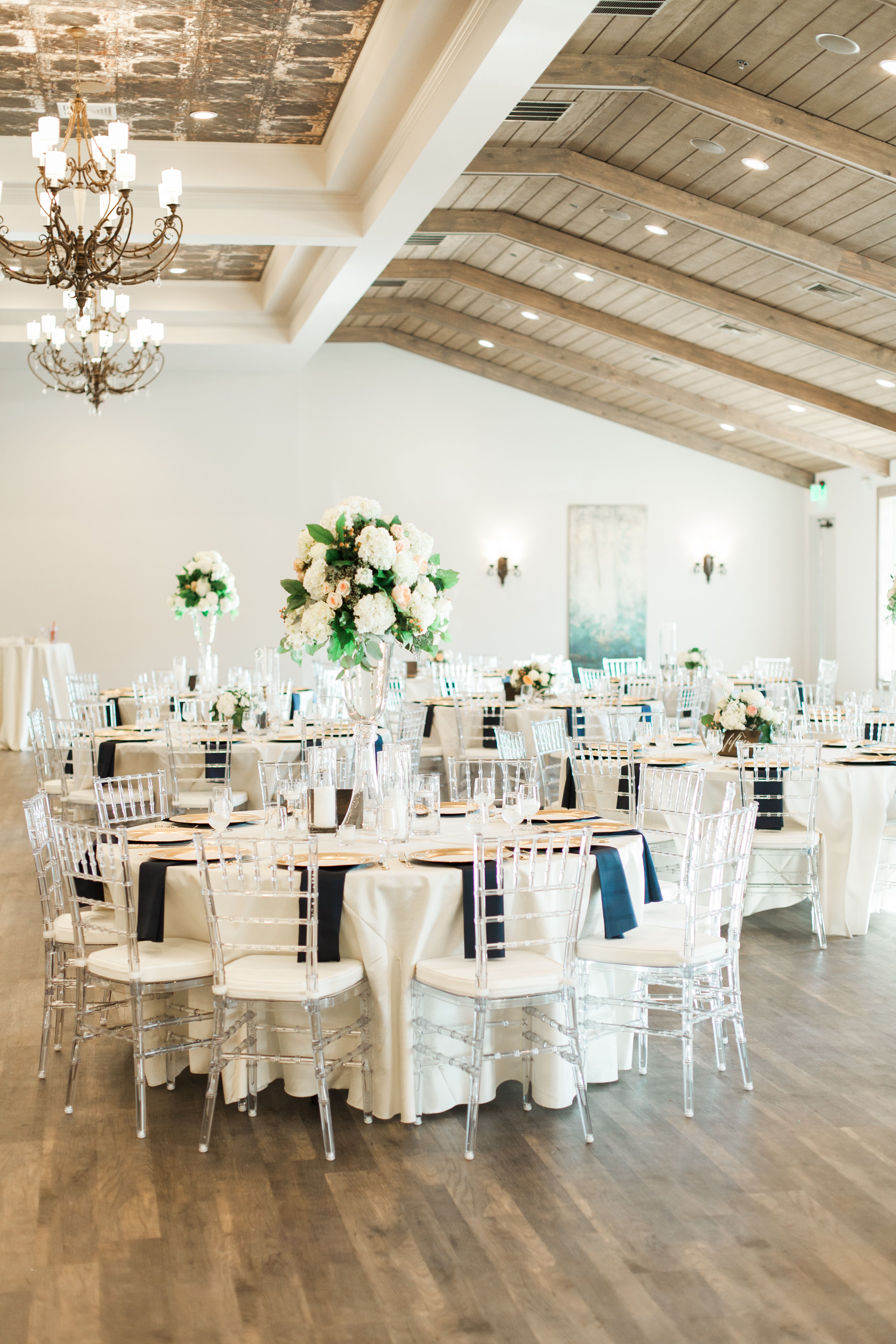 Elegant Tall Centerpieces and Ghost Chiavari Chairs