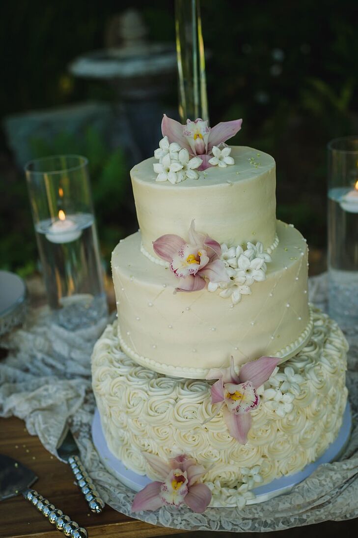 CreamColored Tiered Wedding Cake With Flowers