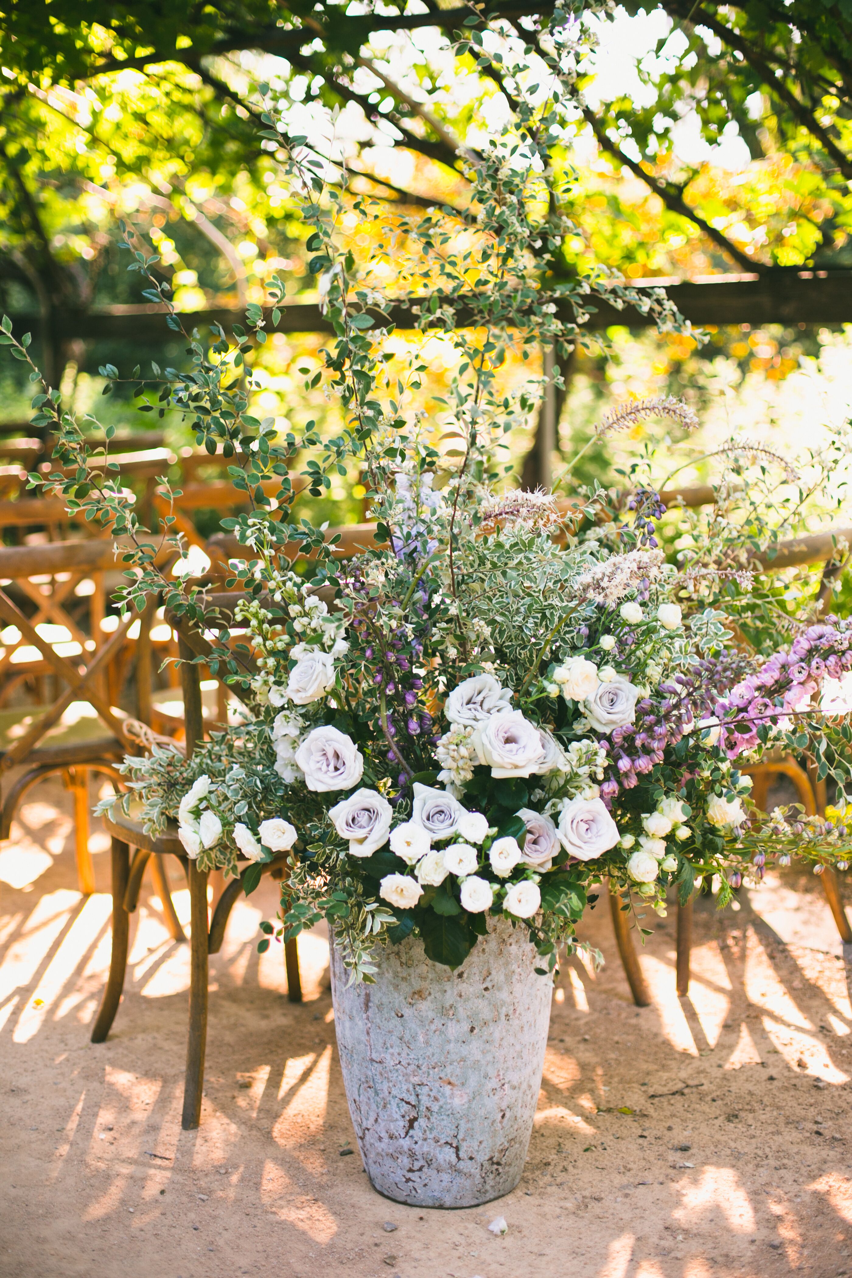 Stone Vases with Purple Roses, Peonies and Greenery