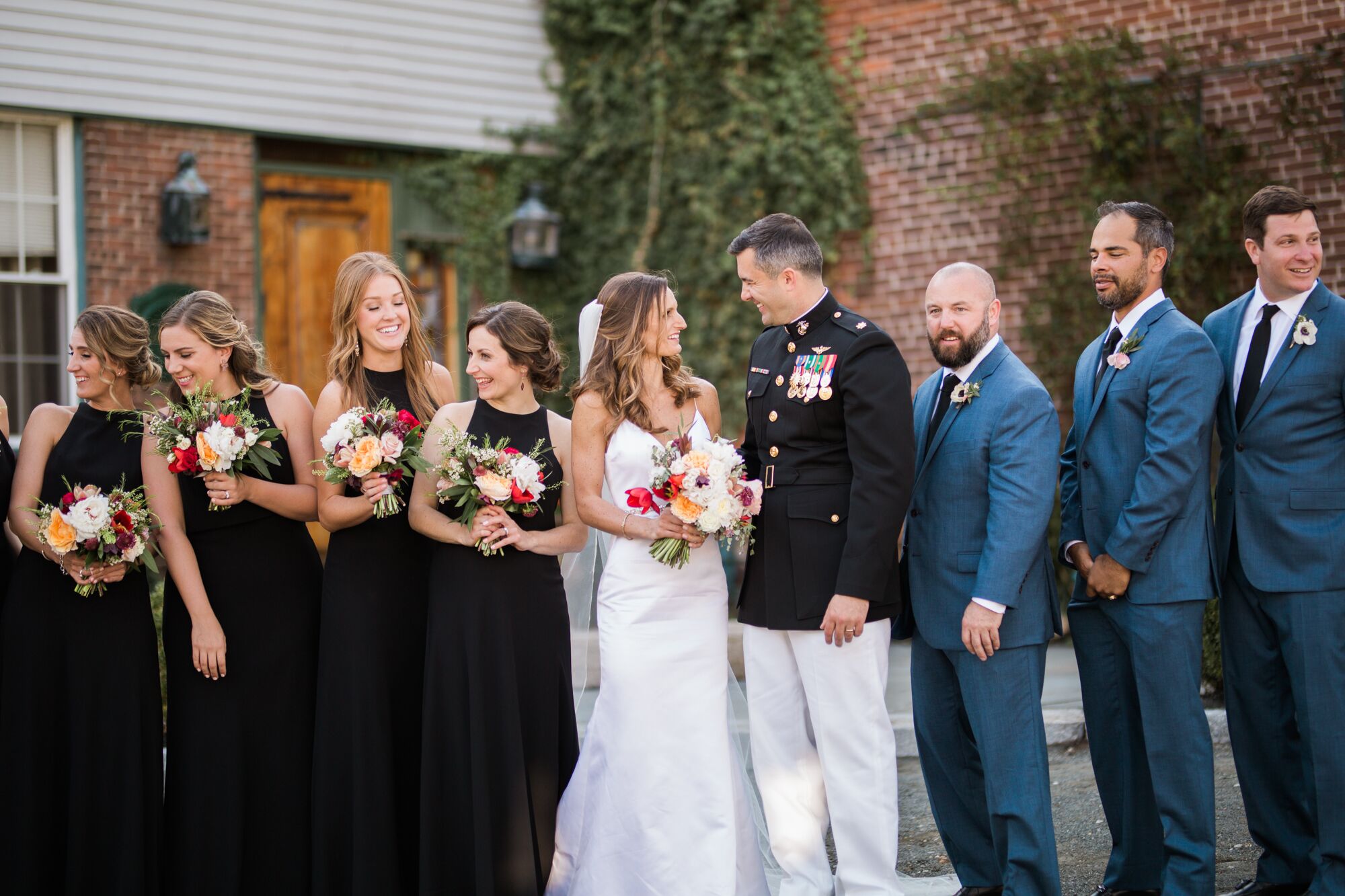 Bridesmaids In Black Gown And Groomsmen In Blue Suits