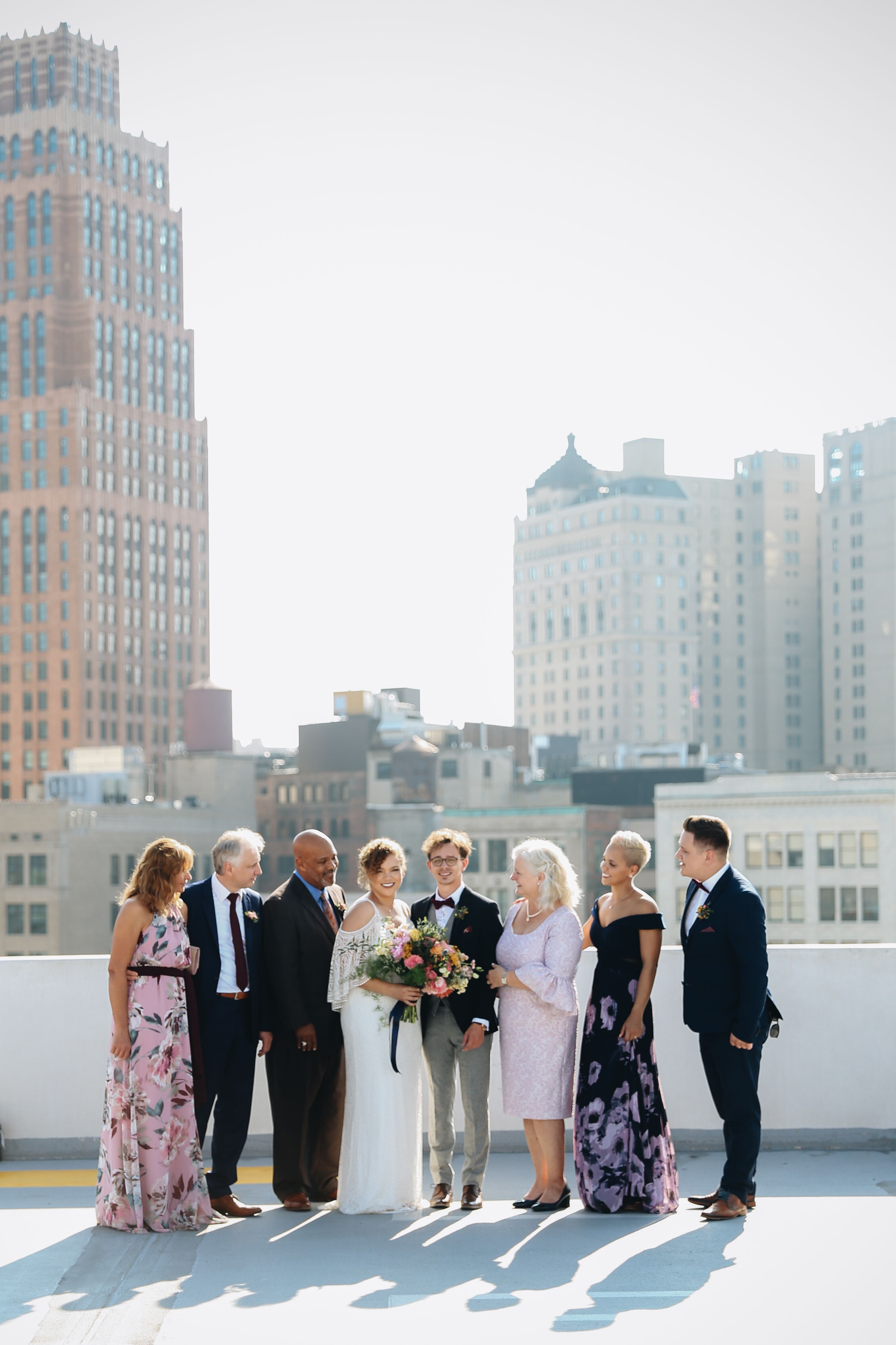 Modern Family Wedding Photo with Skyline Backdrop