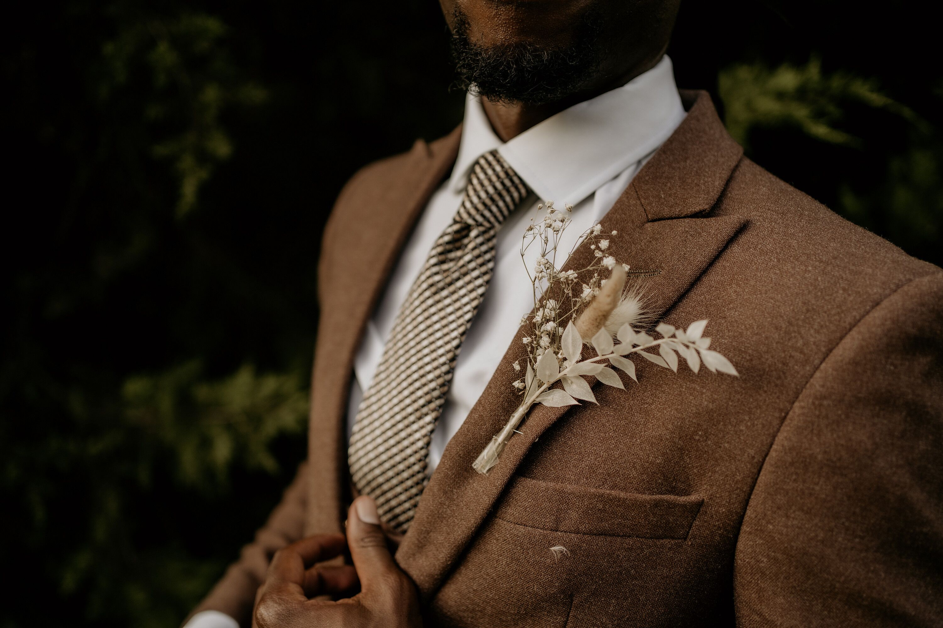 Groom in Brown Suit with Boutonniere of Dried Grasses