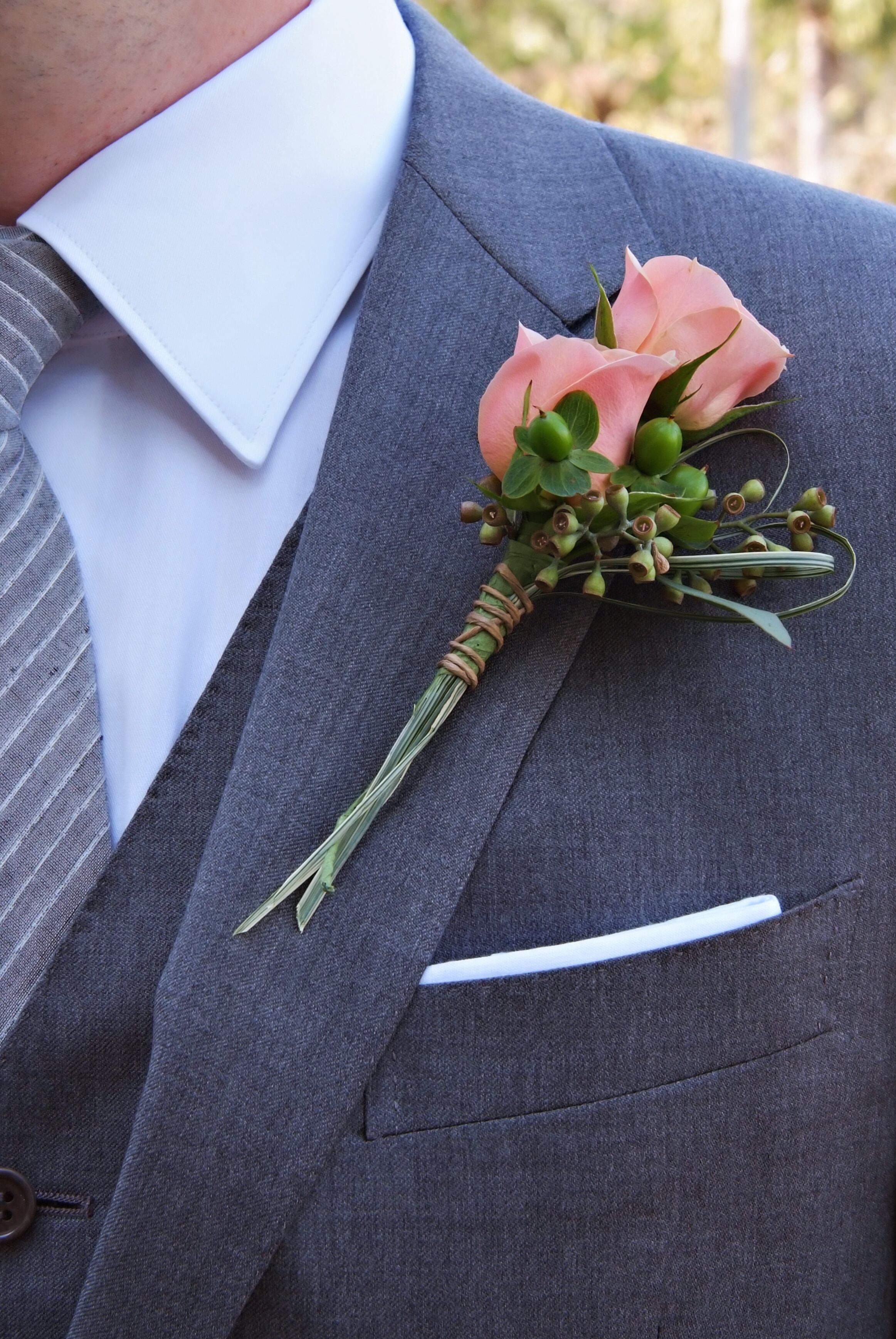 Double Peach Rose and Hypericum Berry Boutonniere