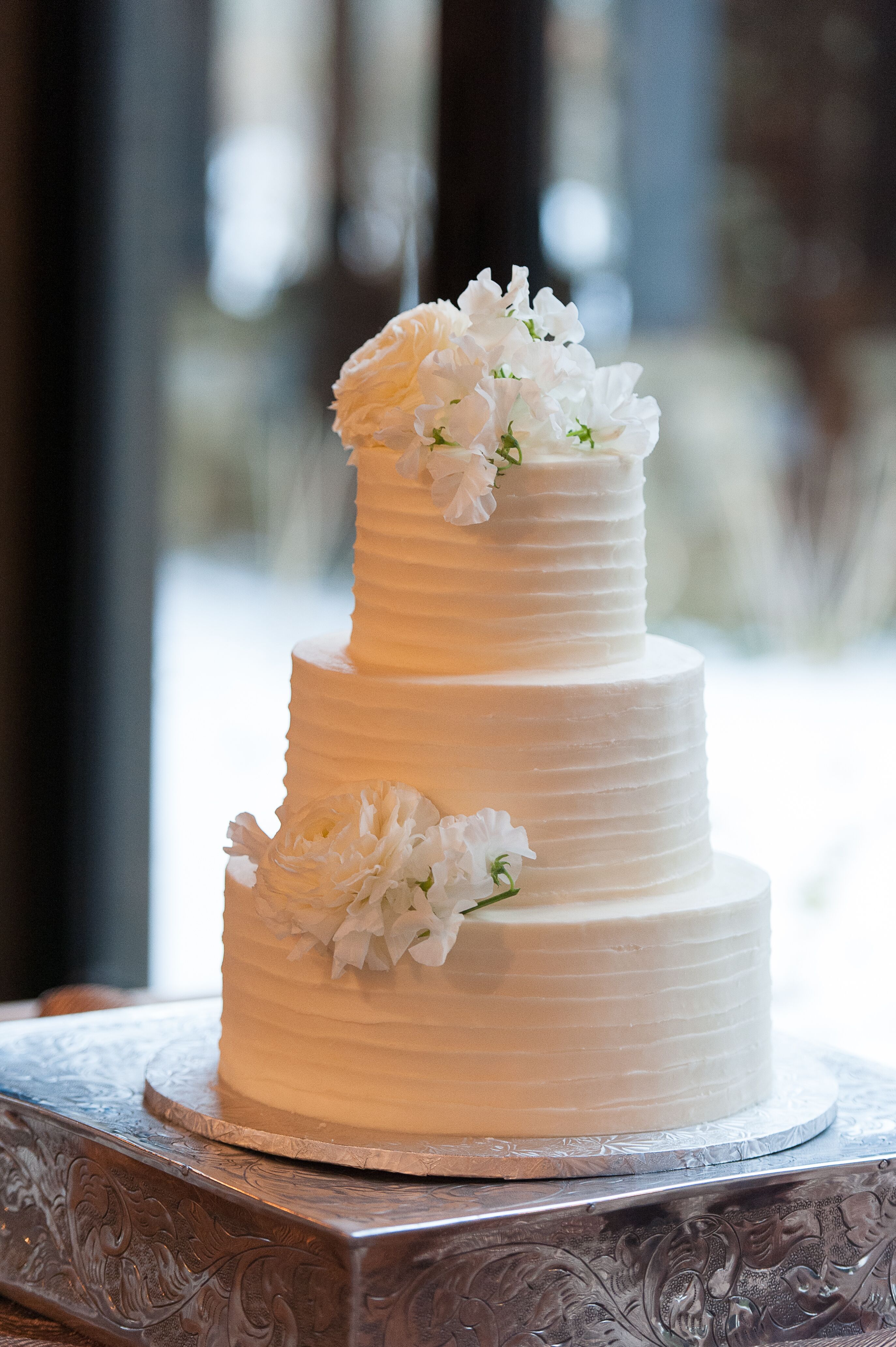 White Lisianthus-Topped Textured White Buttercream Wedding Cake