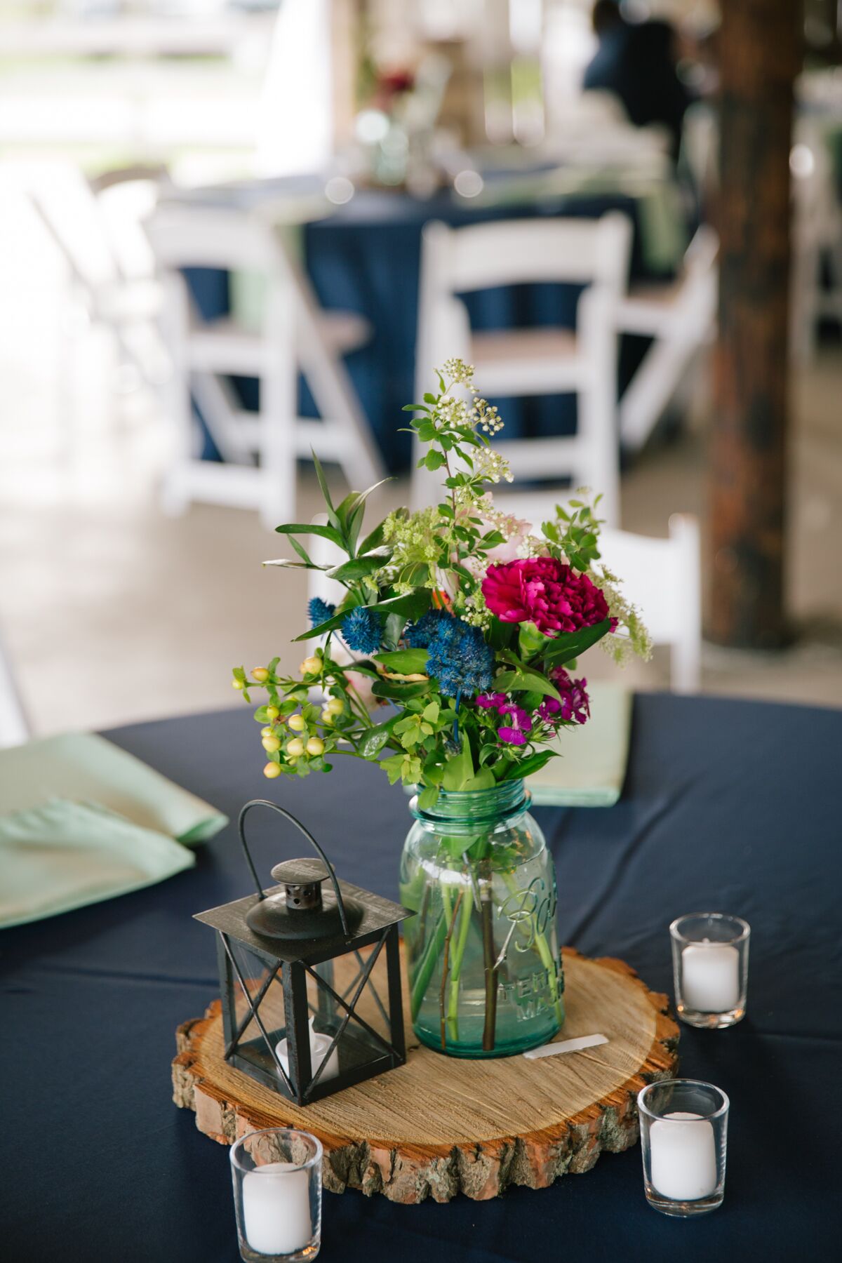 DIY Wooden Slab Centerpieces With Jars and Flowers