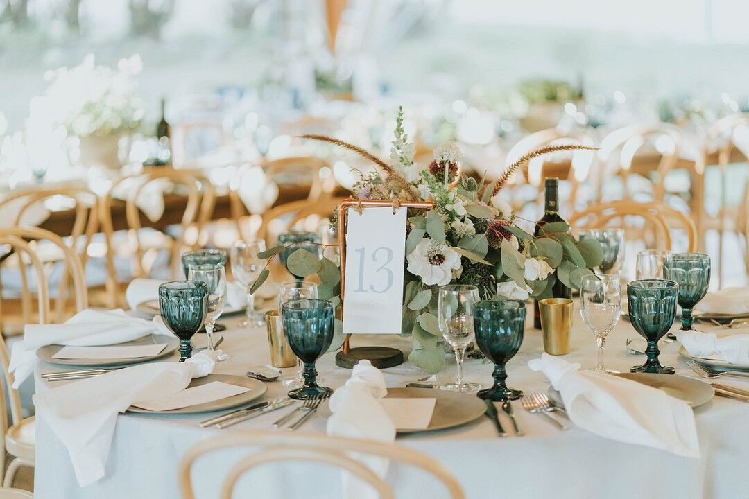 Lush Greenery, Blue Glassware and Brass Elements on Wedding Reception ...