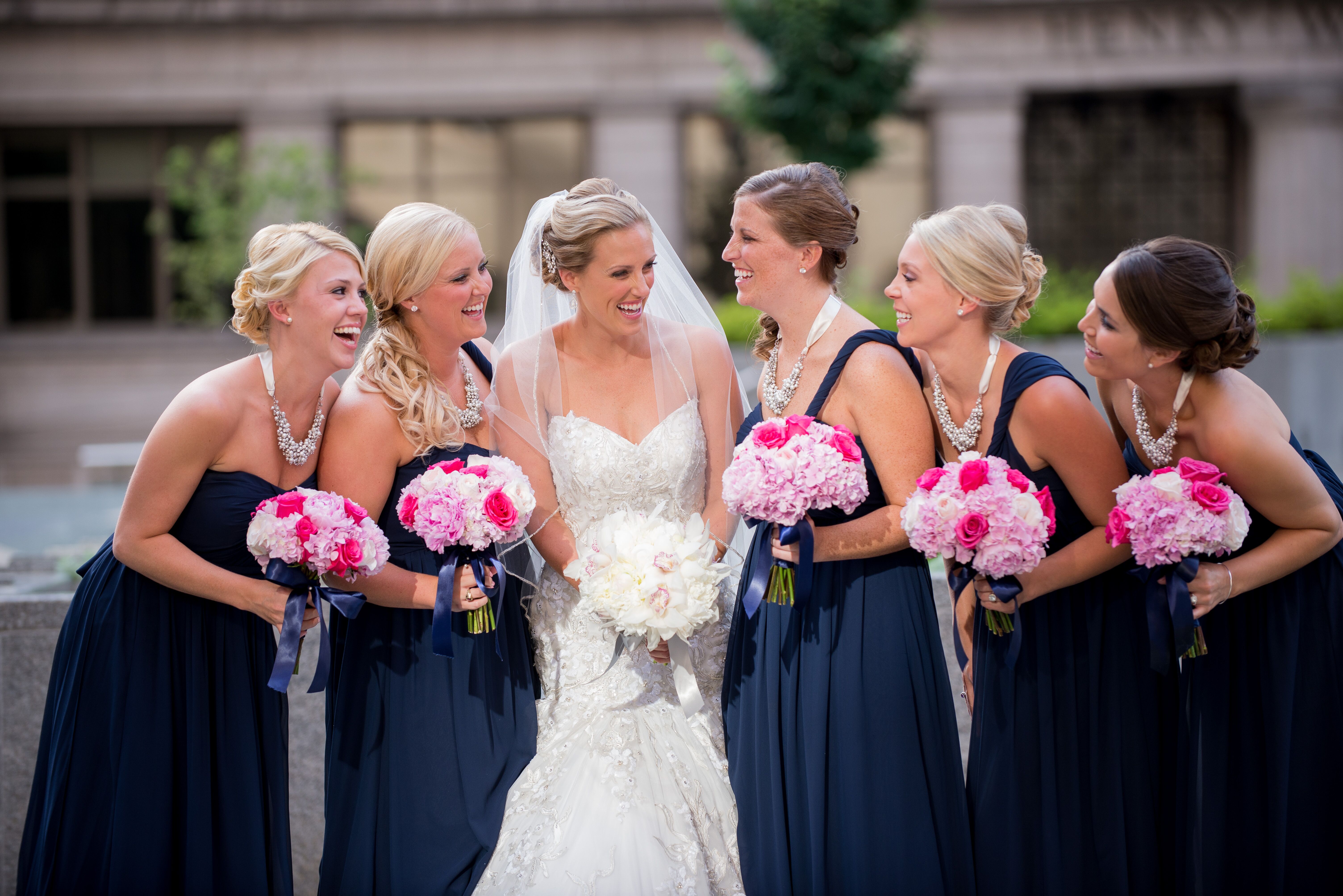 Bridesmaids in Navy with Bright Pink Bouquets