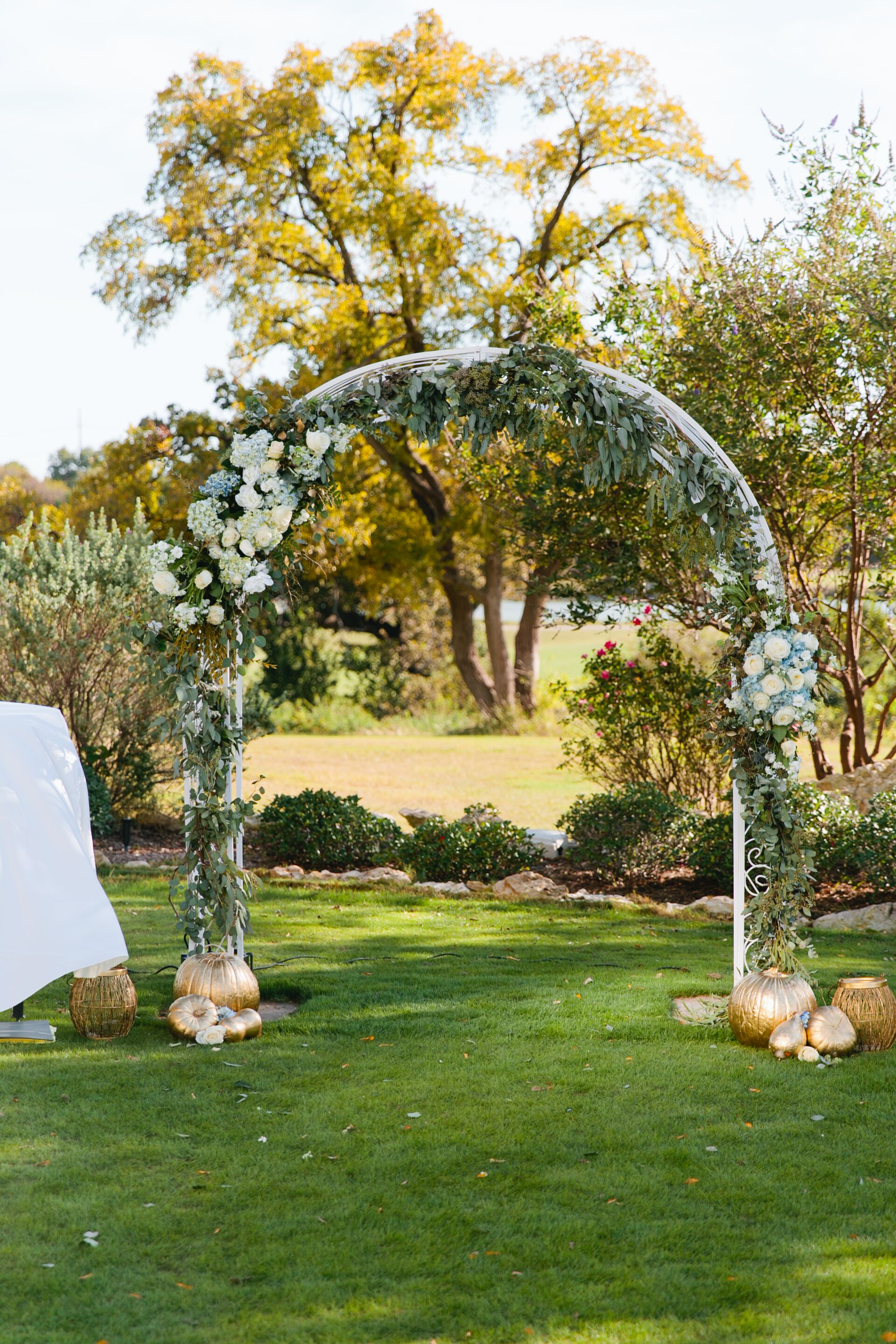 Outdoor Wedding Arch Draped With Hydrangeas Roses And Greenery   5517a496 Aaa9 11e6 B1e3 0e6345a2d5d3