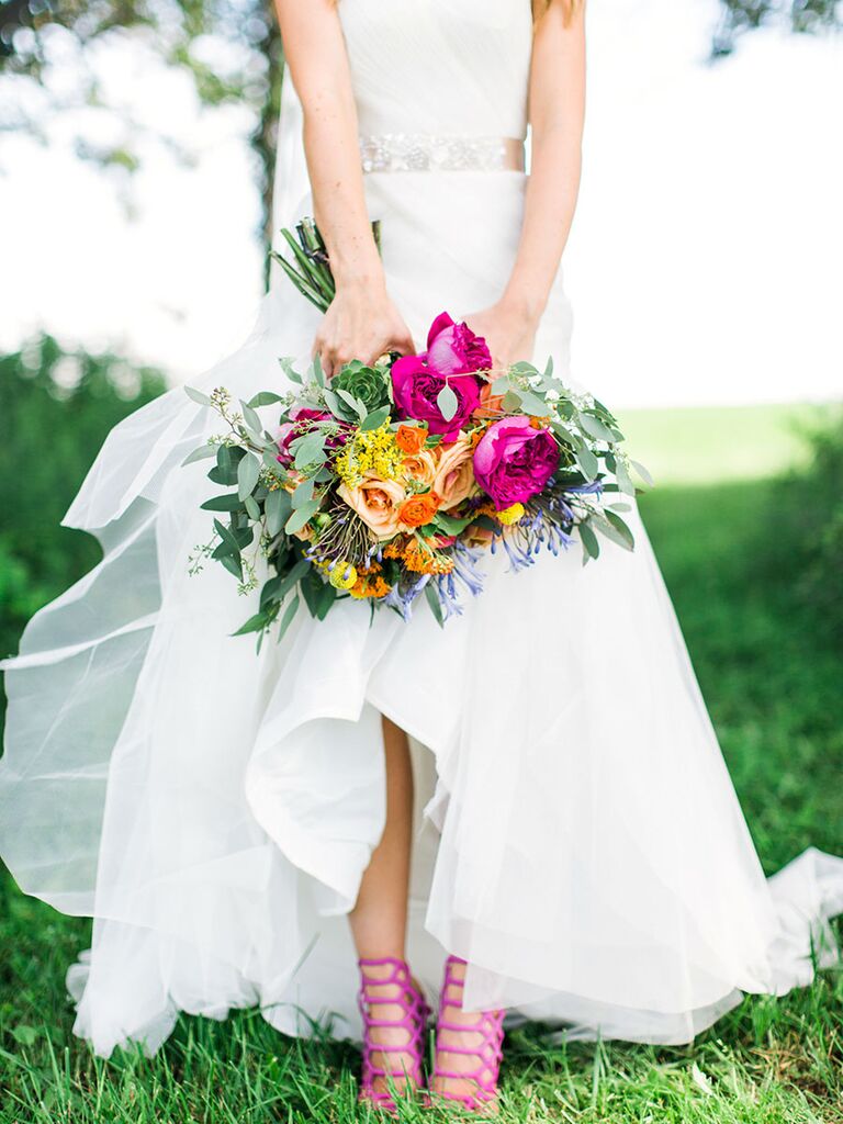 Bride in wedding dress and pink shoes