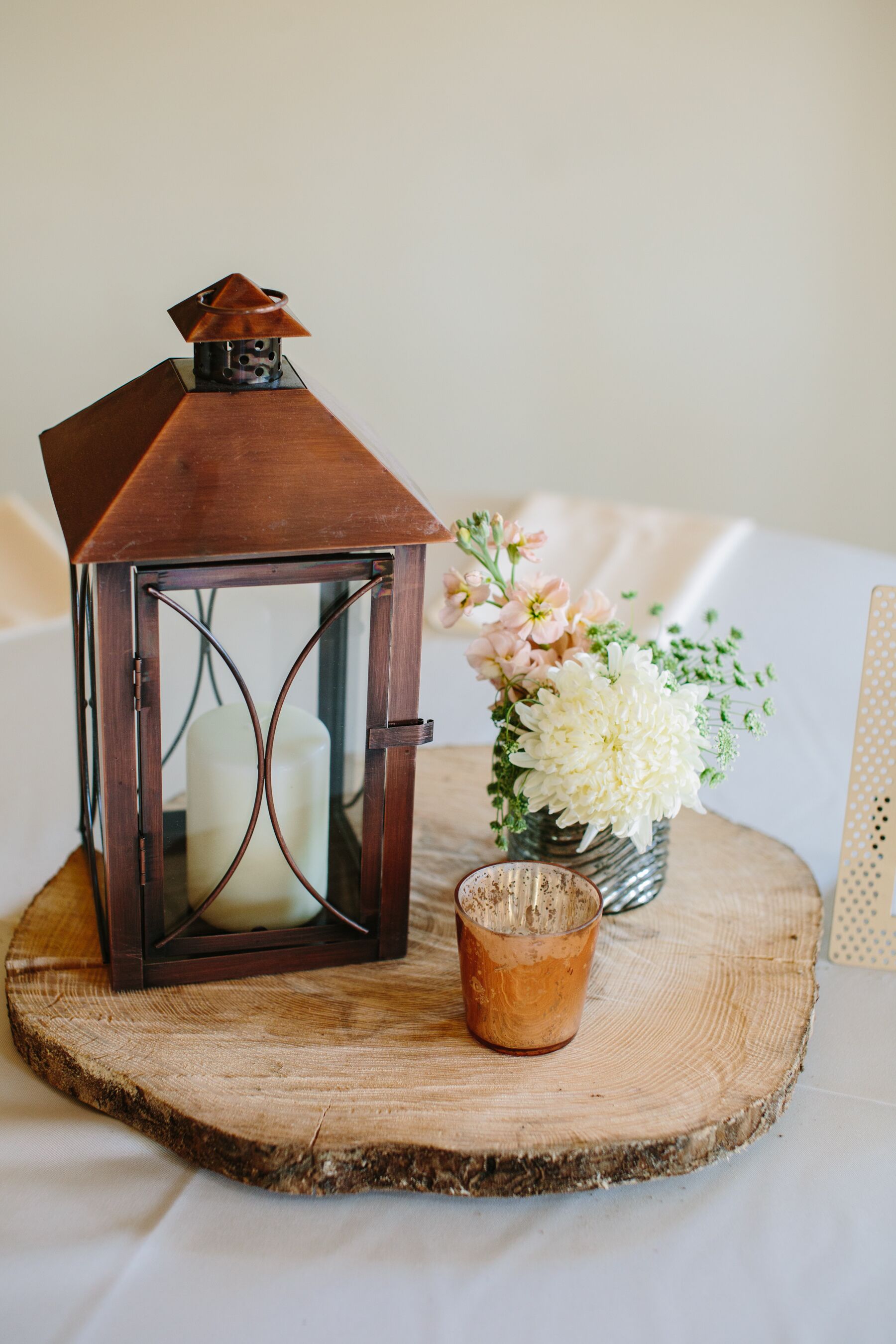 Brown Rustic Lantern With White Candle