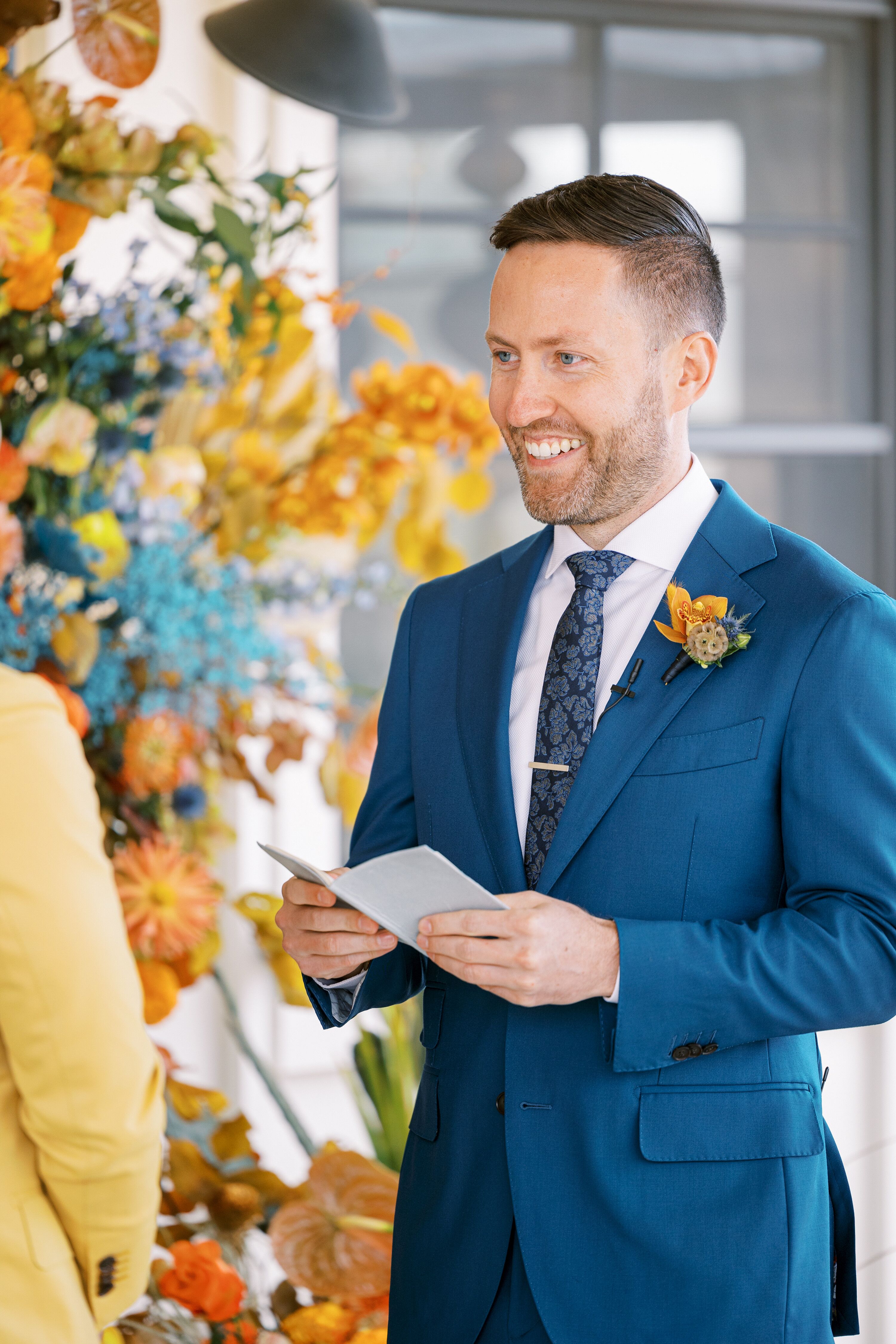 Groom in Blue Wedding Suit Sharing Wedding Ceremony Vows