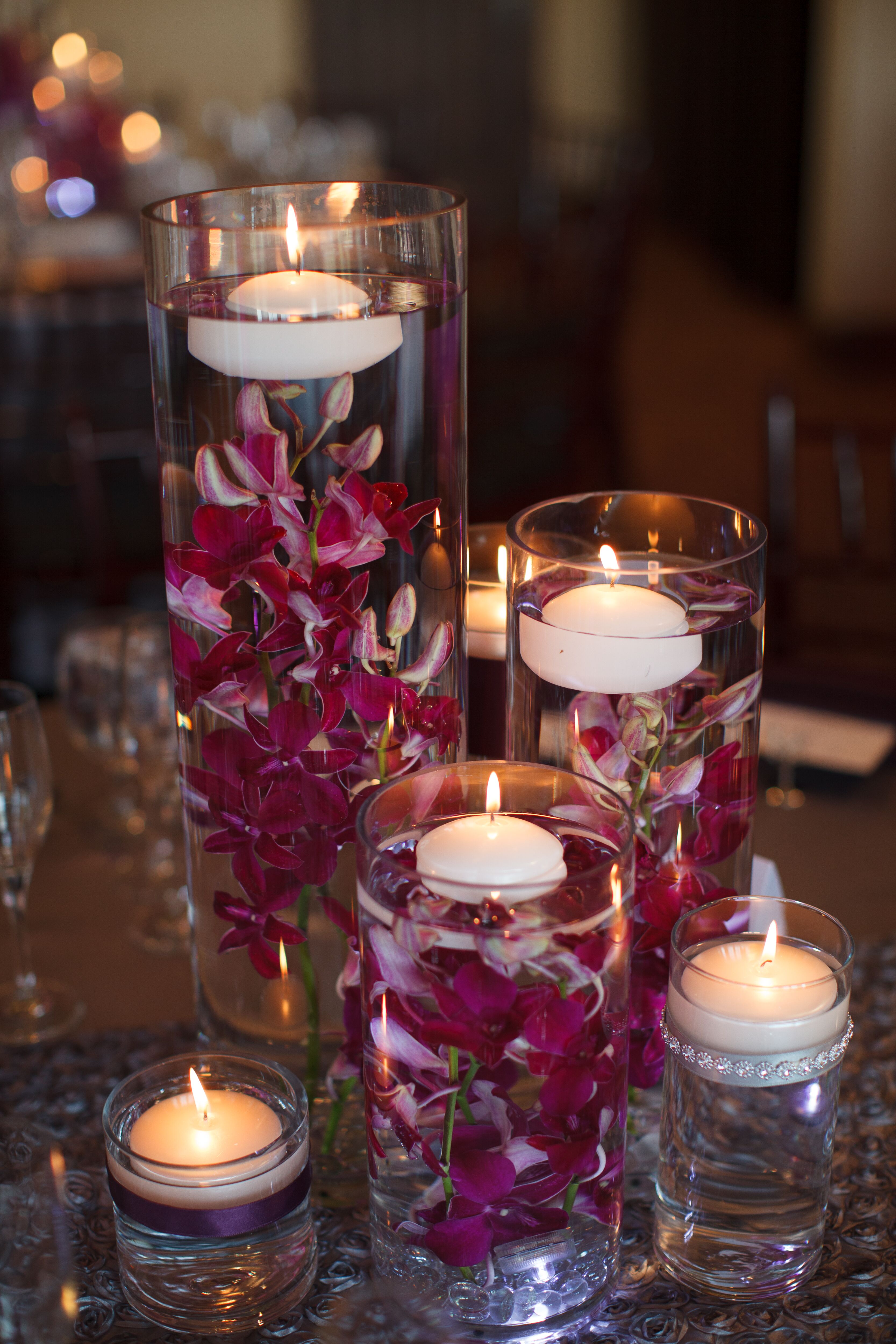 Purple Cymbidium Orchids With Floating Candles