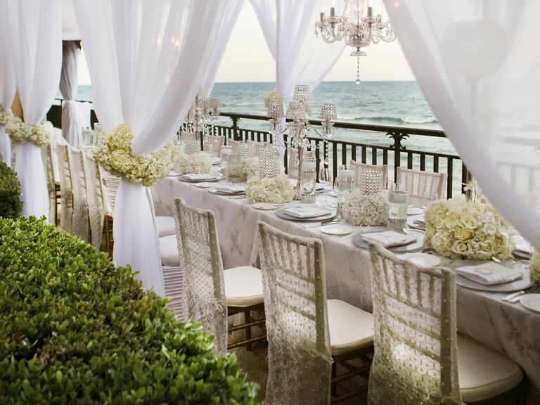 All-white table at intimate beach wedding reception