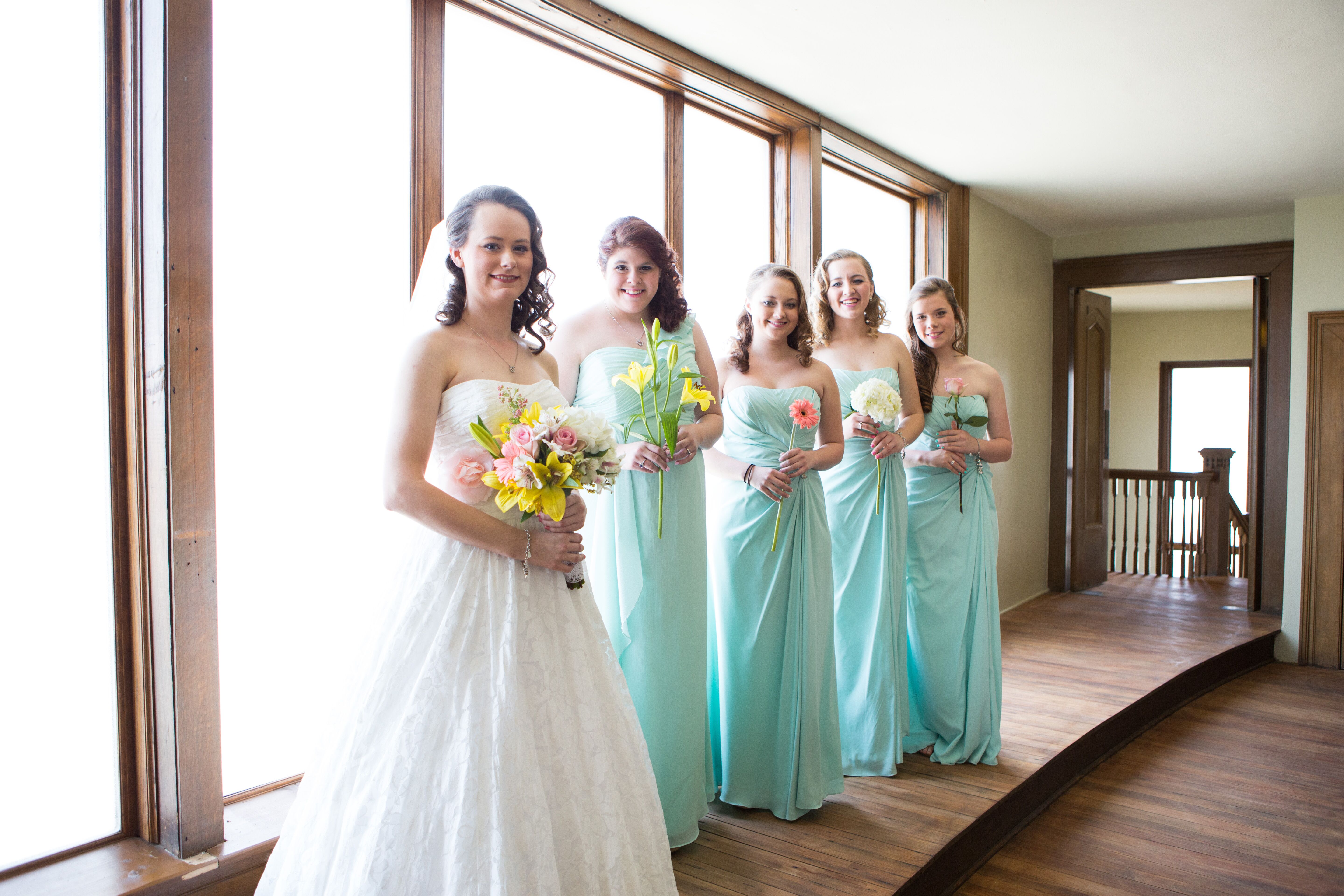 bridesmaids with single flower