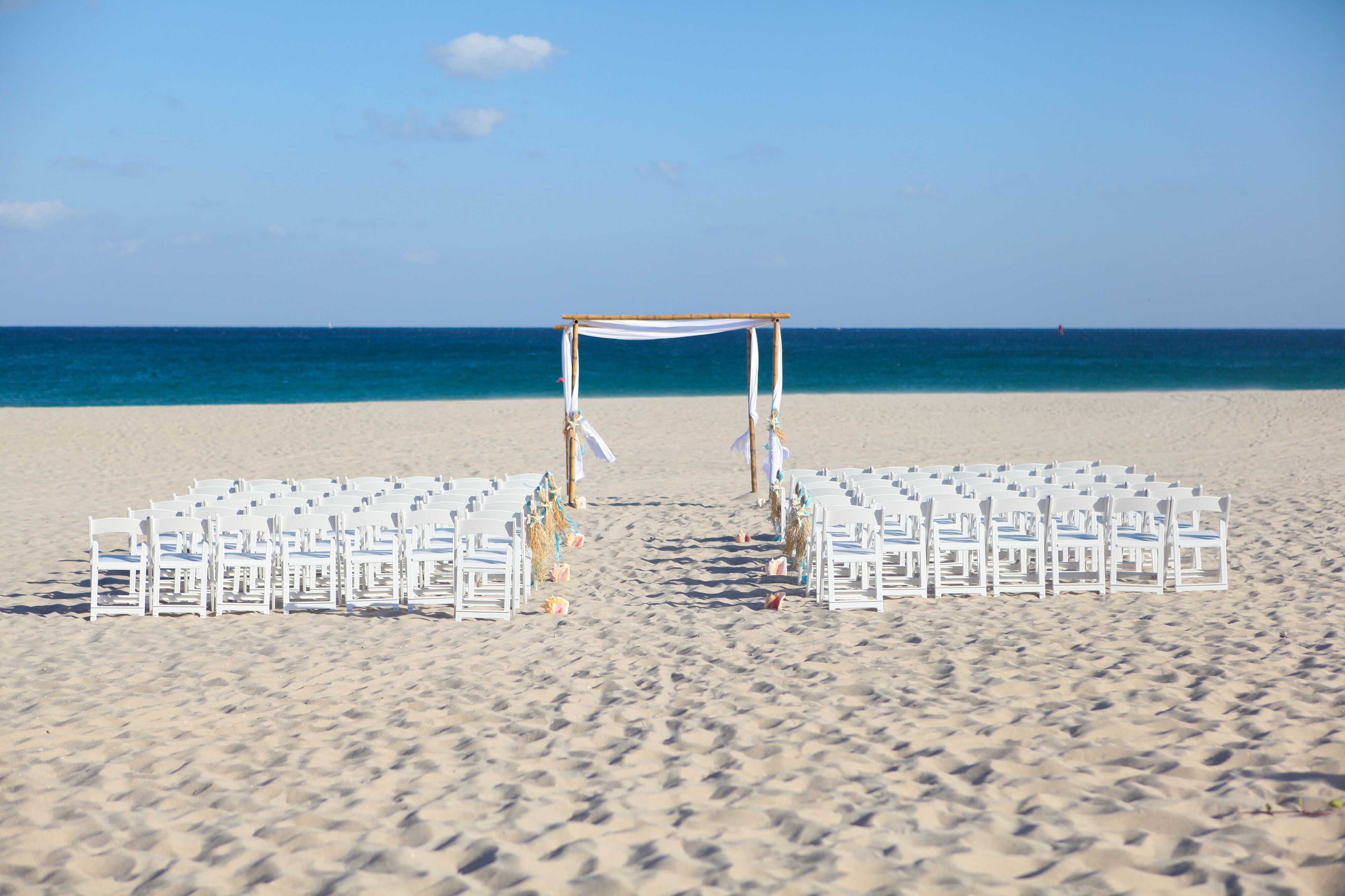 Whimsical Seashell Aisle Decor White Chairs