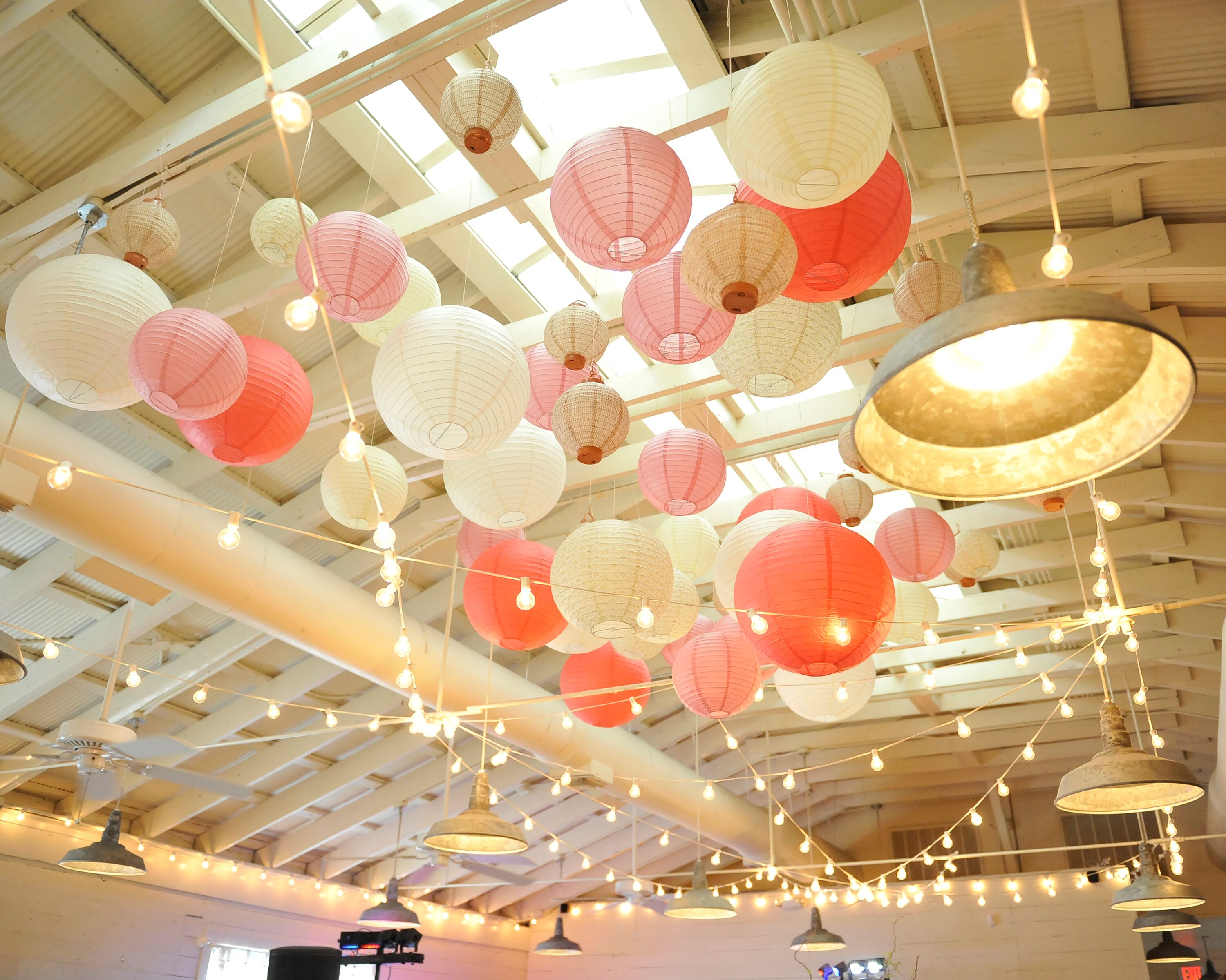 Coral Paper Lanterns and String Lights Ceiling Decor