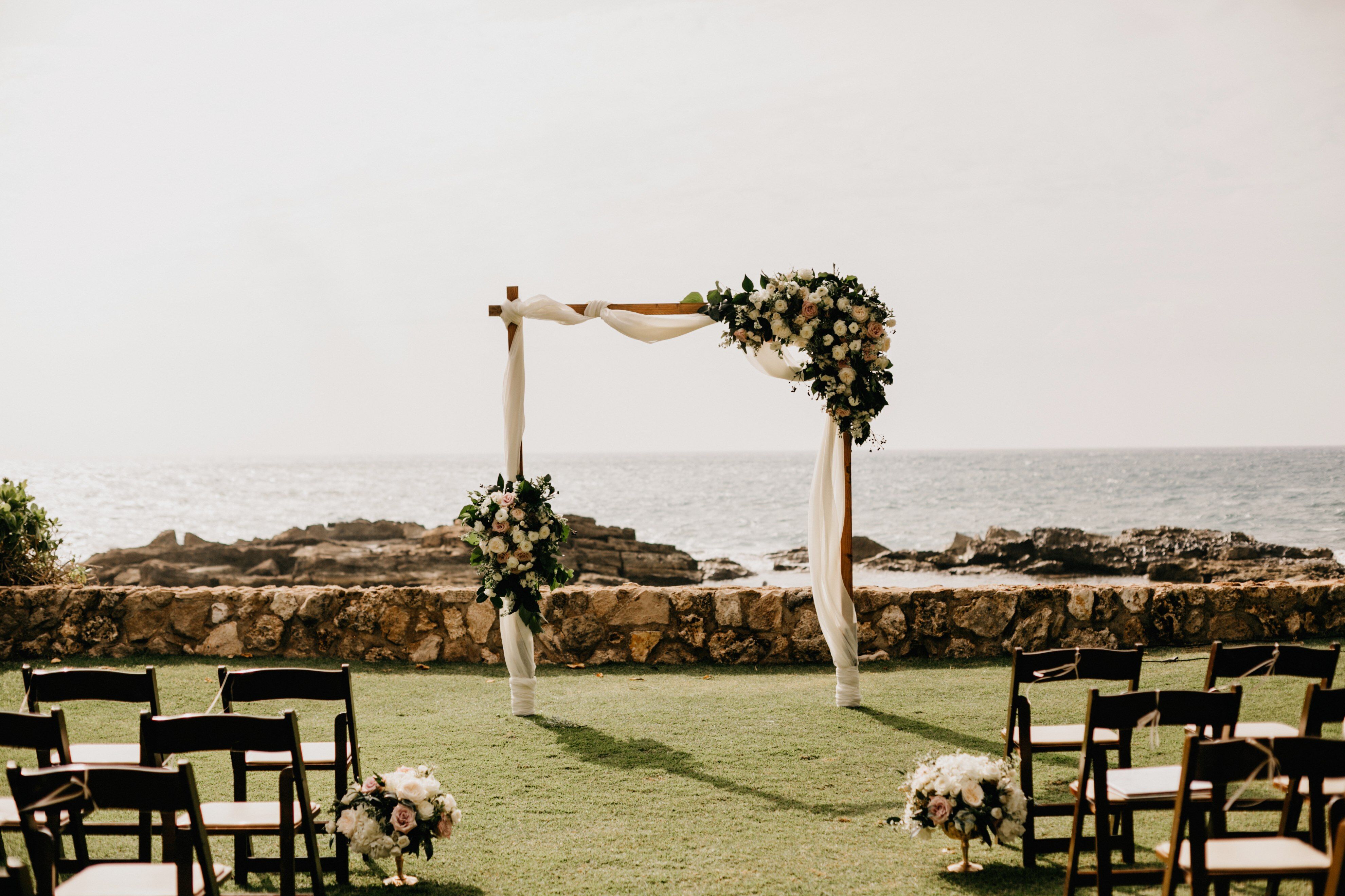 Simple, Elegant White Wedding Arch With Garlands