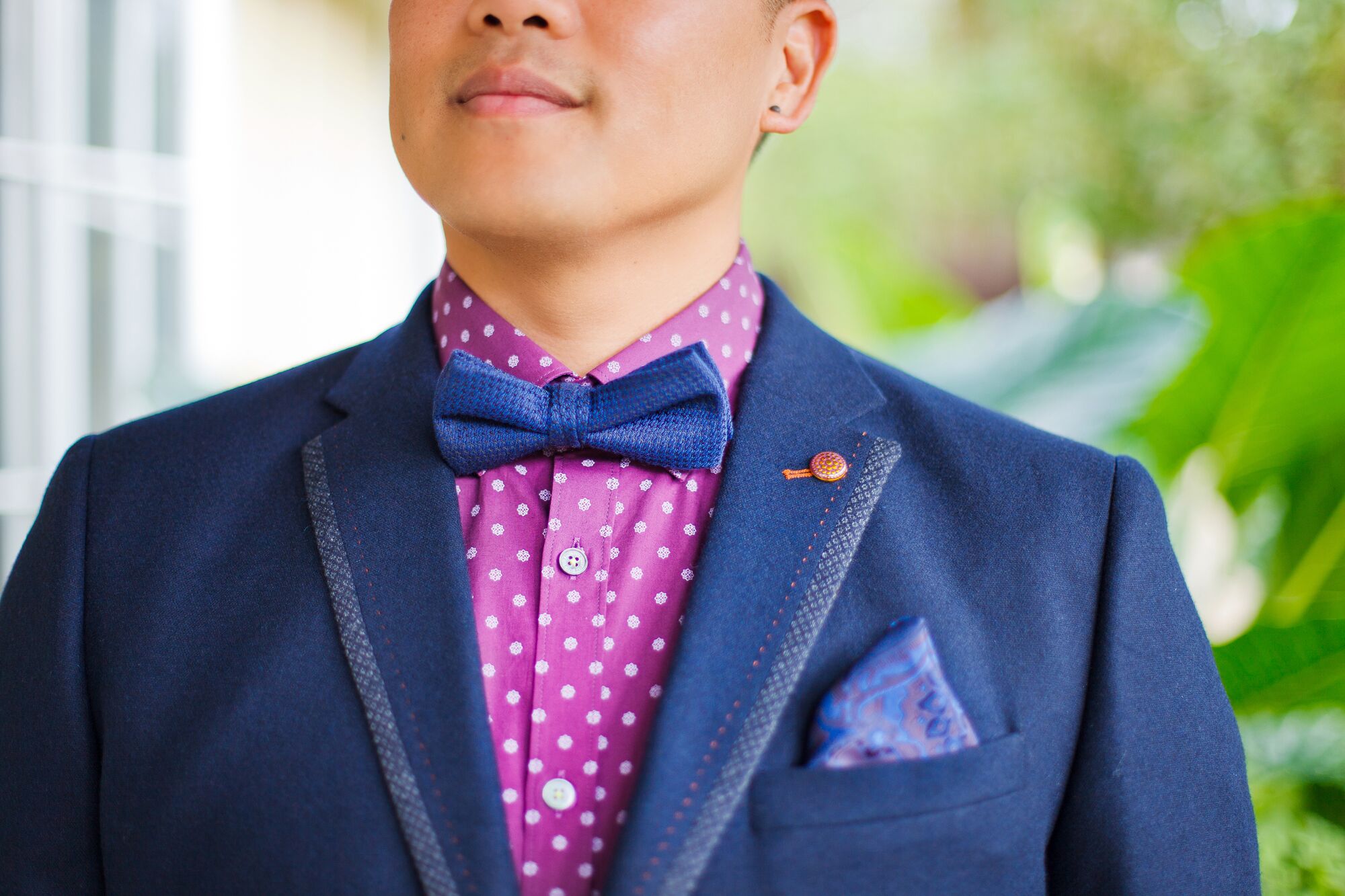 Blue shirt with store purple polka dots