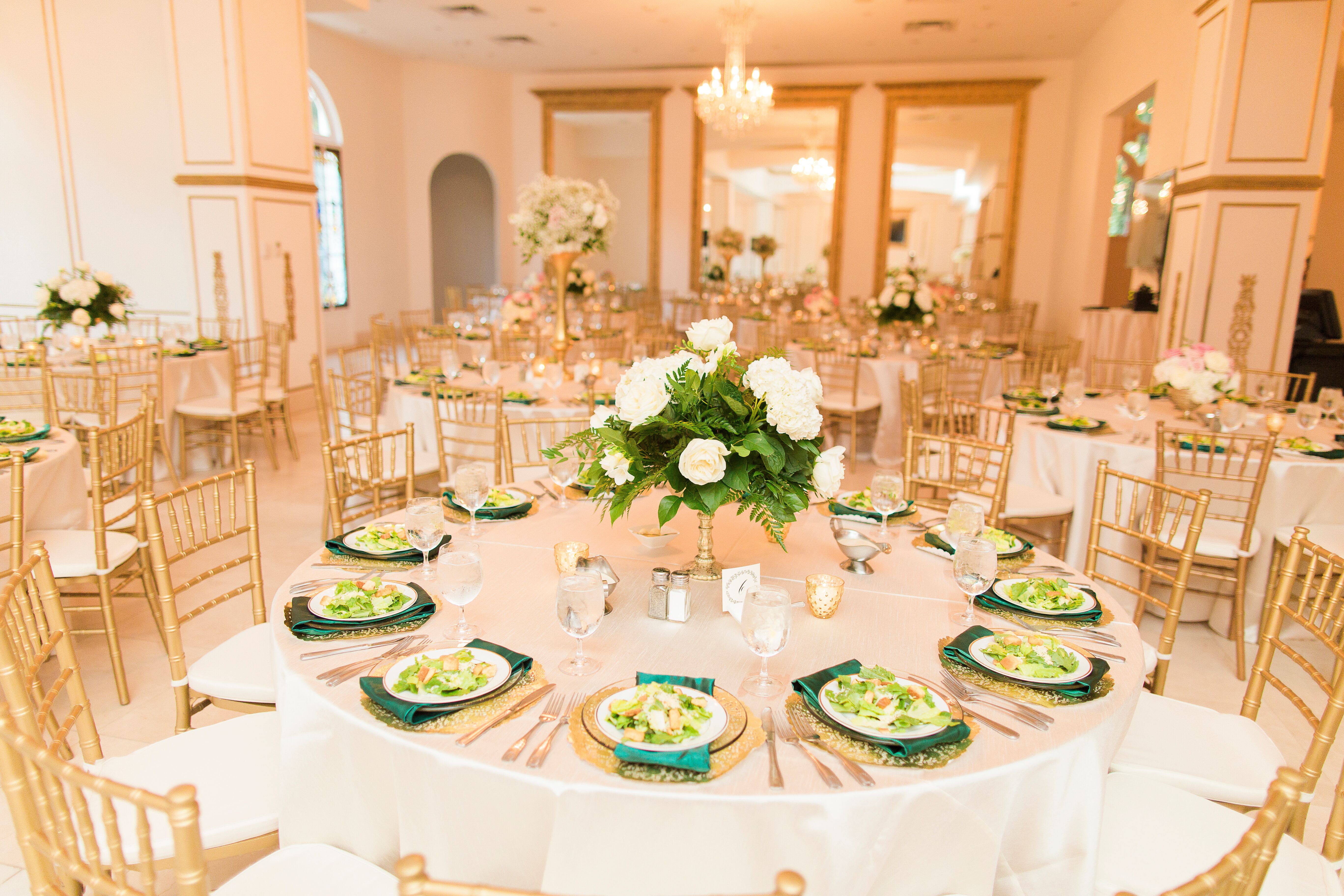 Gold and White Reception Decor With Pops of Emerald Green