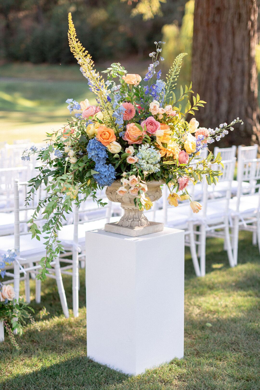 Colorful Aisle Flower Arrangement with Vase on Pedestal