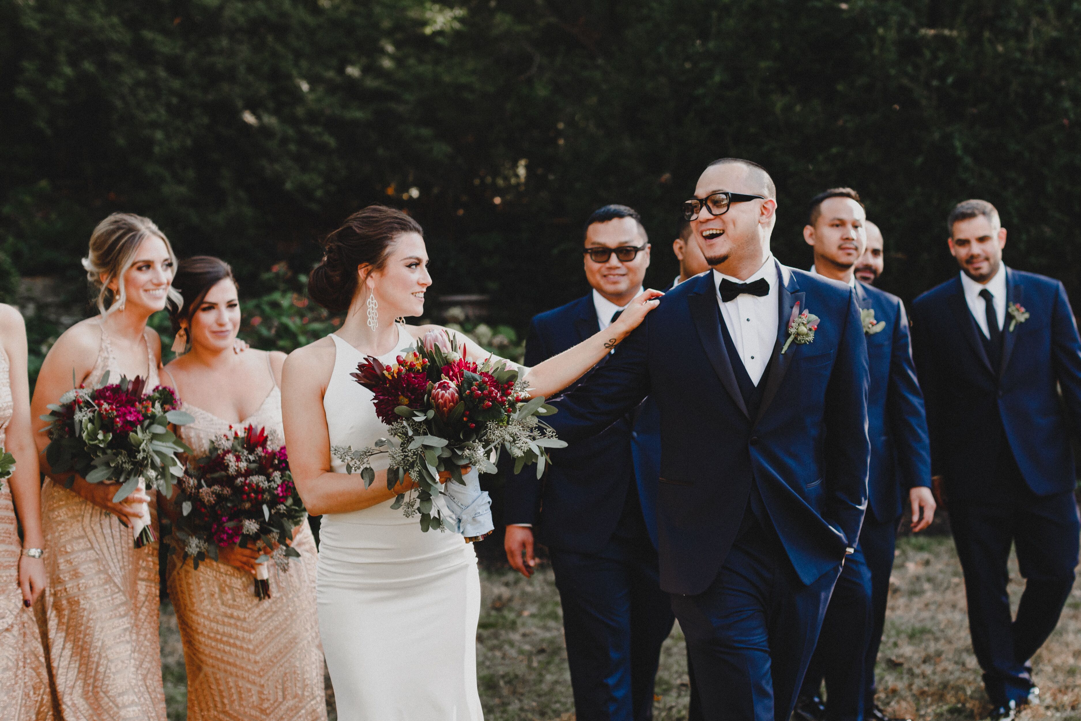 Bridesmaids in Gold Dresses and Groomsmen in Dark Blue Tuxes