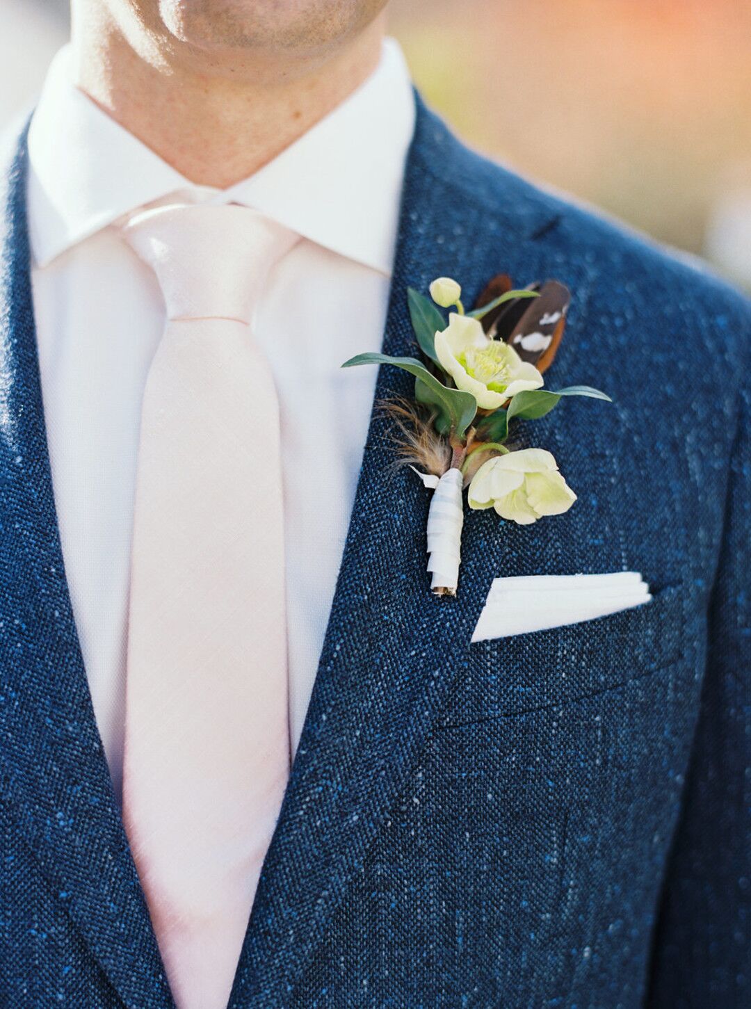 Rustic Boutonniere with Hellebores and Pheasant Feathers