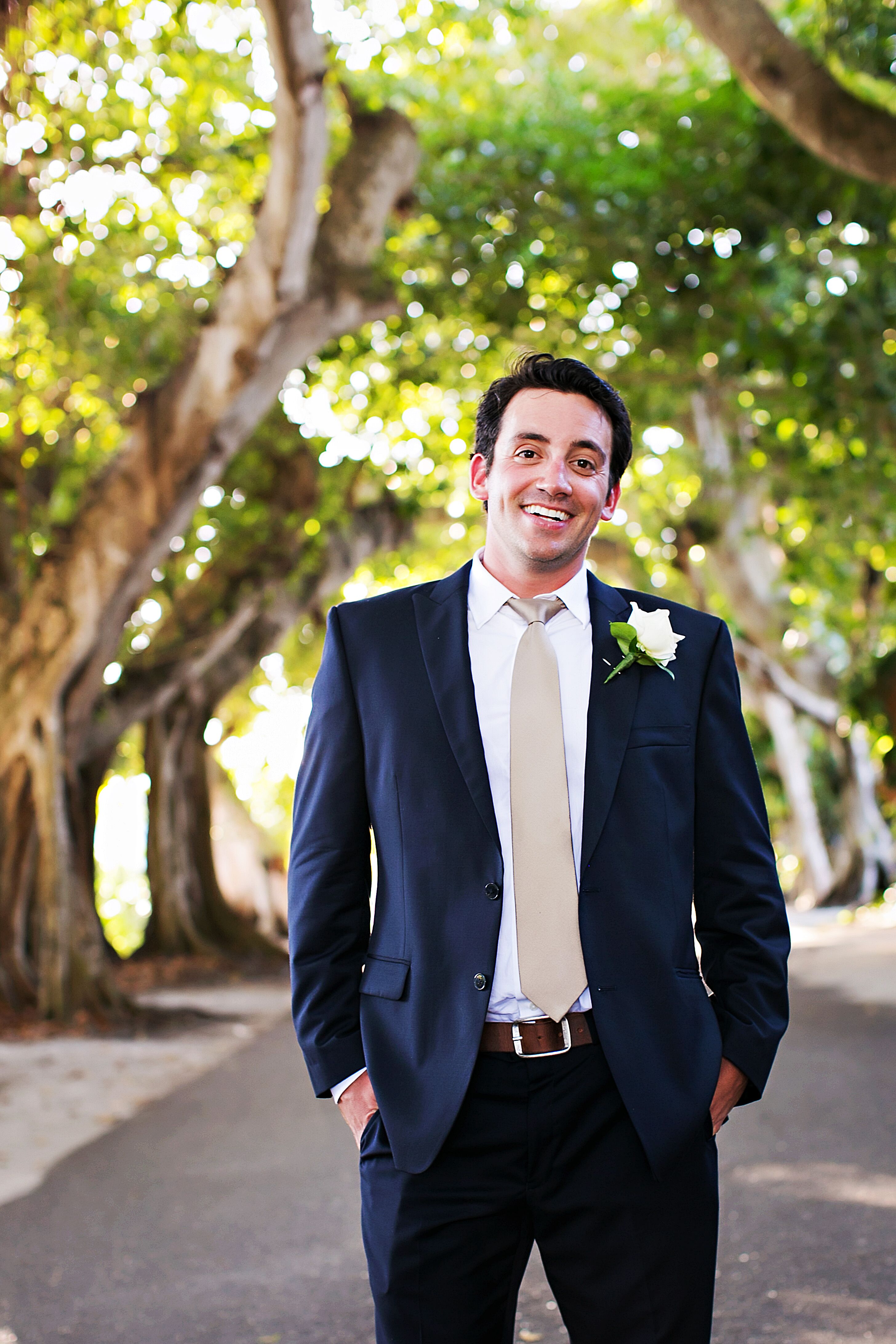 Navy Blue Grooms Suit and Champagne Tie